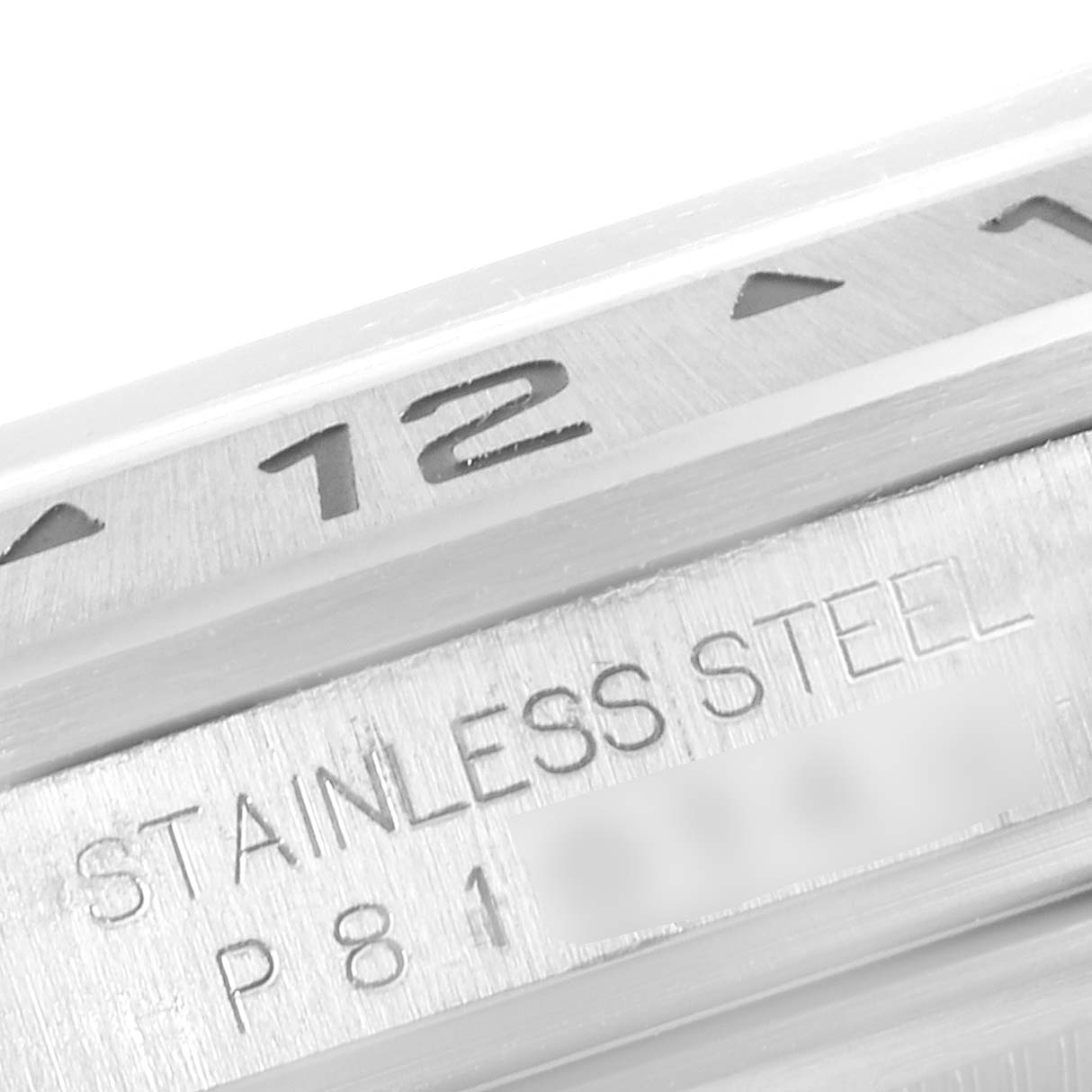 This close-up image shows the bezel and part of the case back of a Rolex Explorer 16570 Men
s Stainless Steel White Dial 16570 Men
s Stainless Steel White Dial watch, highlighting "STAINLESS STEEL."