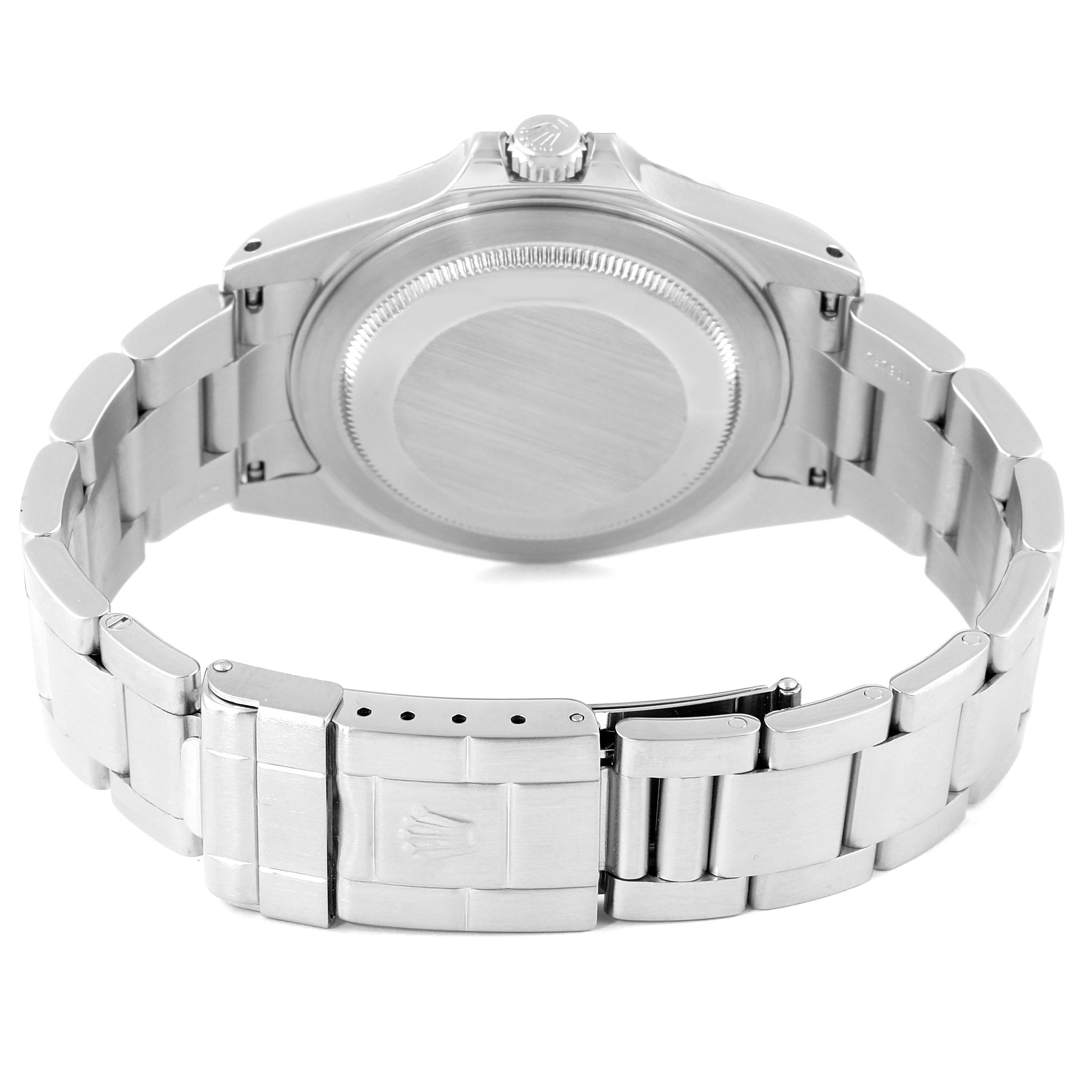 The image shows the underside of a Rolex Explorer 16570 Men
s Stainless Steel White Dial 16570 Men
s Stainless Steel White Dial, detailing its stainless steel bracelet and closed case back.
