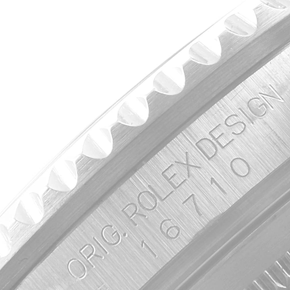 This image shows an angled close-up of the engraved caseback of a Rolex GMT-Master 16710 Men
s Stainless Steel Black Dial 16710 Men
s Stainless Steel Black Dial, featuring model number 16710.
