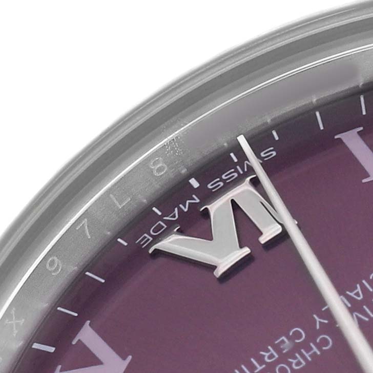The image shows a close-up of the Rolex Mid-Size 177200 Women's Stainless Steel Purple Dial watch face, focusing on the edge with visible Roman numerals, minute markers, and part of the hands.