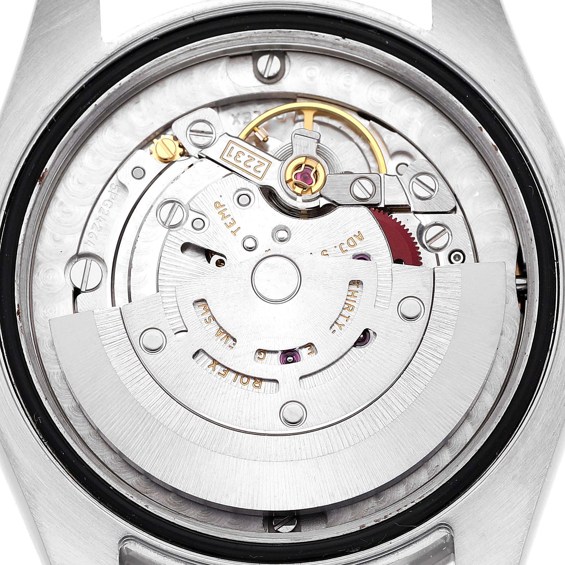 The image shows the movement from the back of a Mid-Size Rolex watch, highlighting the rotor and internal mechanics.