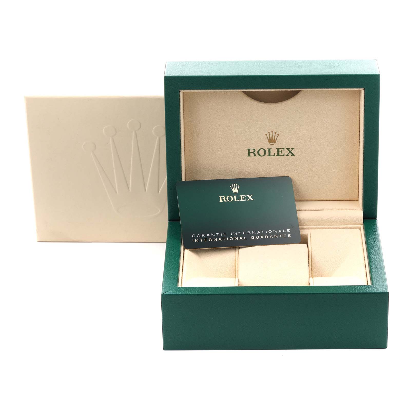 The image shows an open Rolex box for the Oyster Perpetual model, featuring the inner lining and a warranty card.