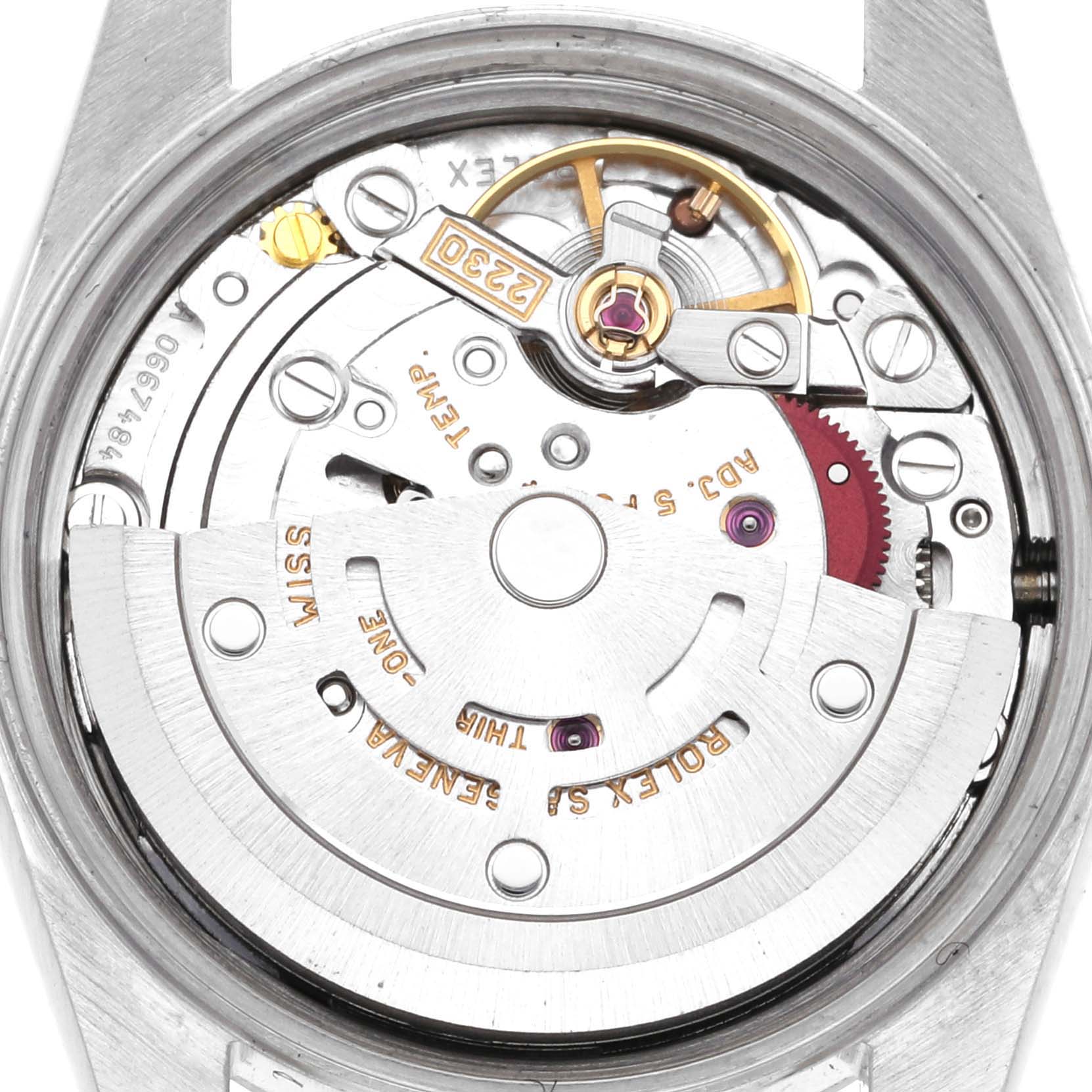 The image shows the internal mechanism of a Rolex Oyster Perpetual 76080 Women's Stainless Steel Orange Dial 76080 Women's Stainless Steel Orange Dial, focusing on the rotor and movement components.