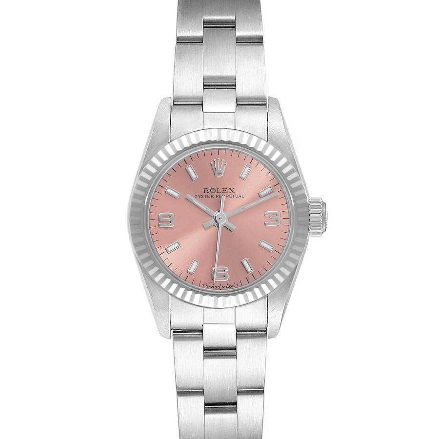 The Rolex Oyster Perpetual watch is shown from a front angle, highlighting its pink dial, bezel, crown, and bracelet.