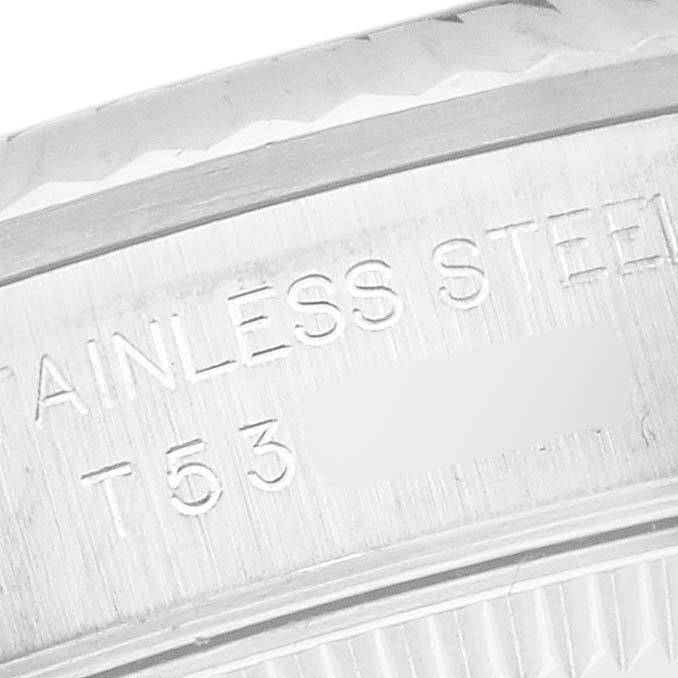 The image shows a close-up of the stainless steel inner engraving on the Rolex Oyster Perpetual 67194 Women's Steel and Gold (two tone) Orange Dial 67194 Women's Steel and Gold (two tone) Orange Dial watch.