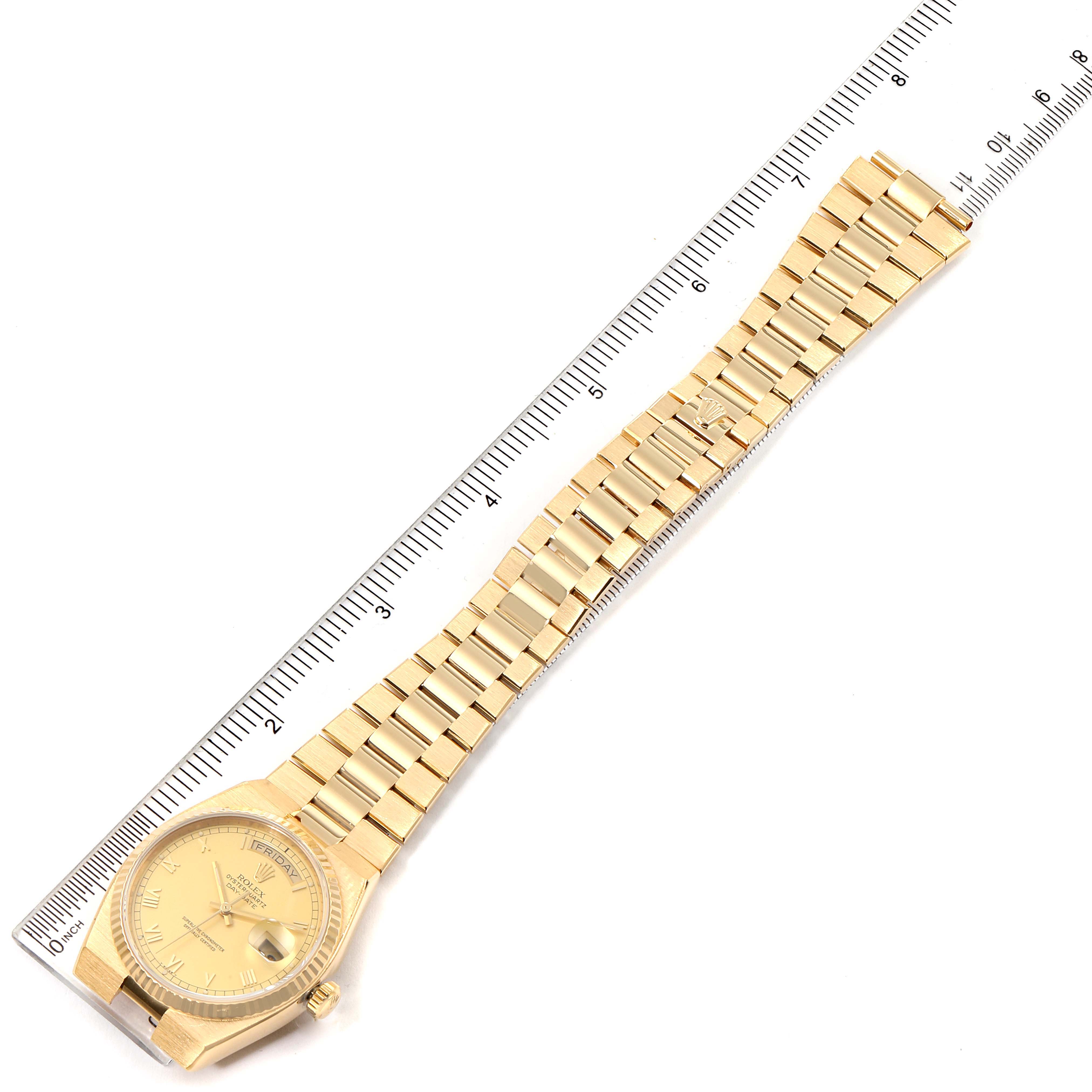 The image shows a Rolex President 19018 Men's Yellow Gold Champagne Dial 19018 Men's Yellow Gold Champagne Dial model watch laid flat with a ruler to indicate its length.