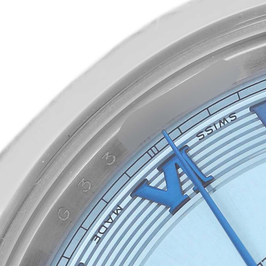 The image shows a close-up of the Rolex President 218206 Men's Platinum Blue Dial watch's dial, focusing on the Roman numeral VI and the minute track.