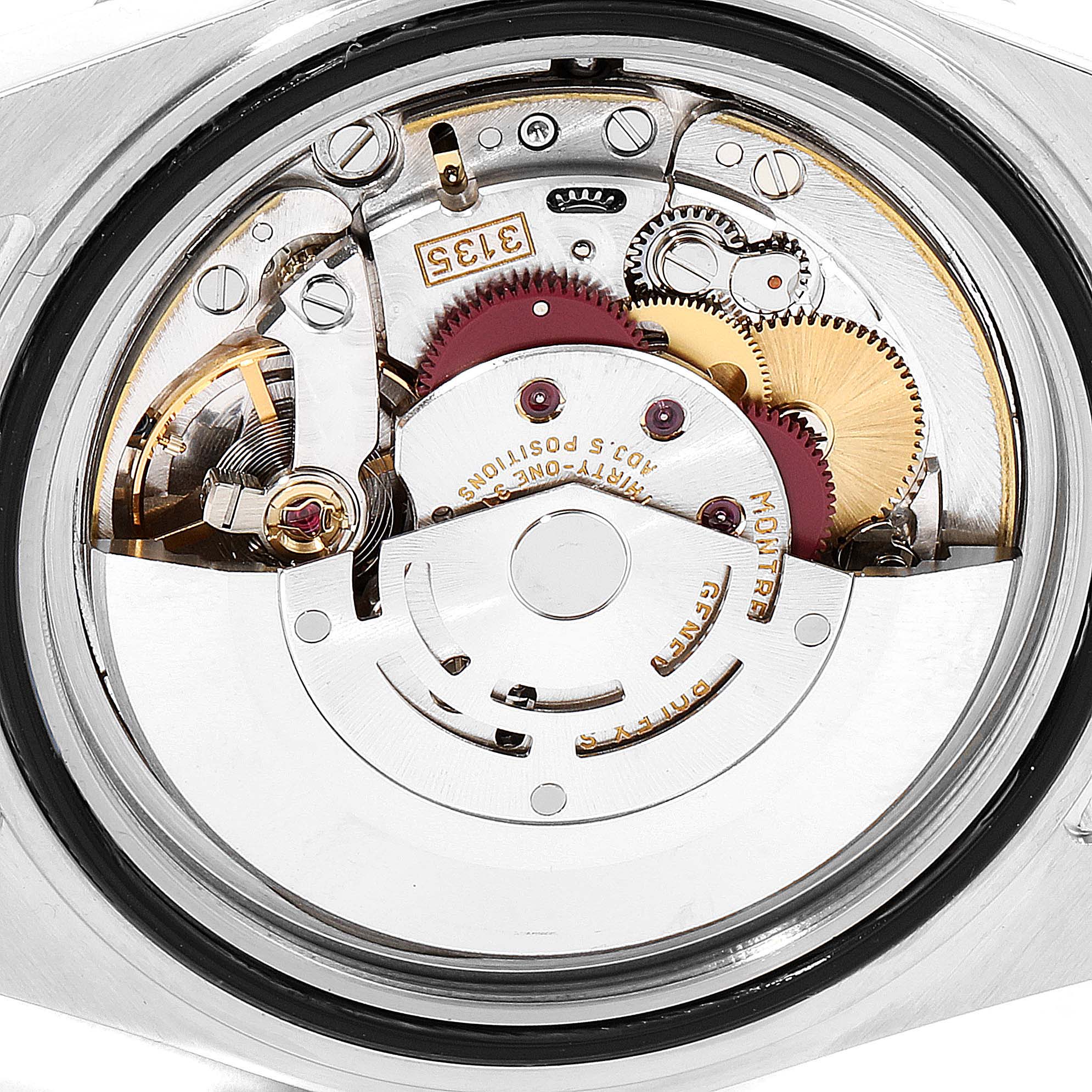 This image shows the movement mechanism of the Rolex Submariner 16613 Men's Steel and Gold (two tone) Blue Dial 16613 Men's Steel and Gold (two tone) Blue Dial watch from a back angle, displaying gears and components.