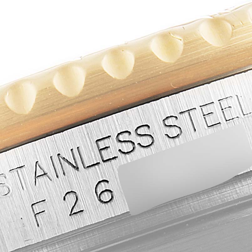 This close-up image shows the edge of the bezel and the engraved serial number of a Rolex Submariner 16613 Men's Steel and Gold (two tone) Blue Dial 16613 Men's Steel and Gold (two tone) Blue Dial watch.