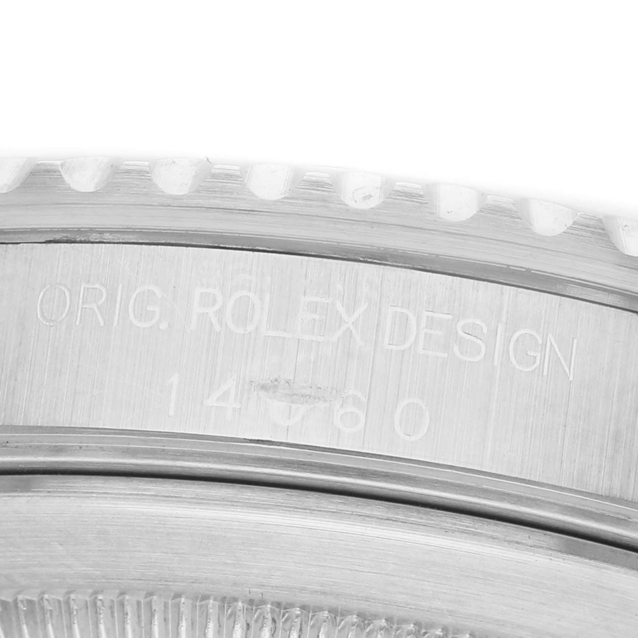 The image shows an angled view of a Rolex Submariner 14060 Men's Stainless Steel Black Dial's case side with the engraved model number.