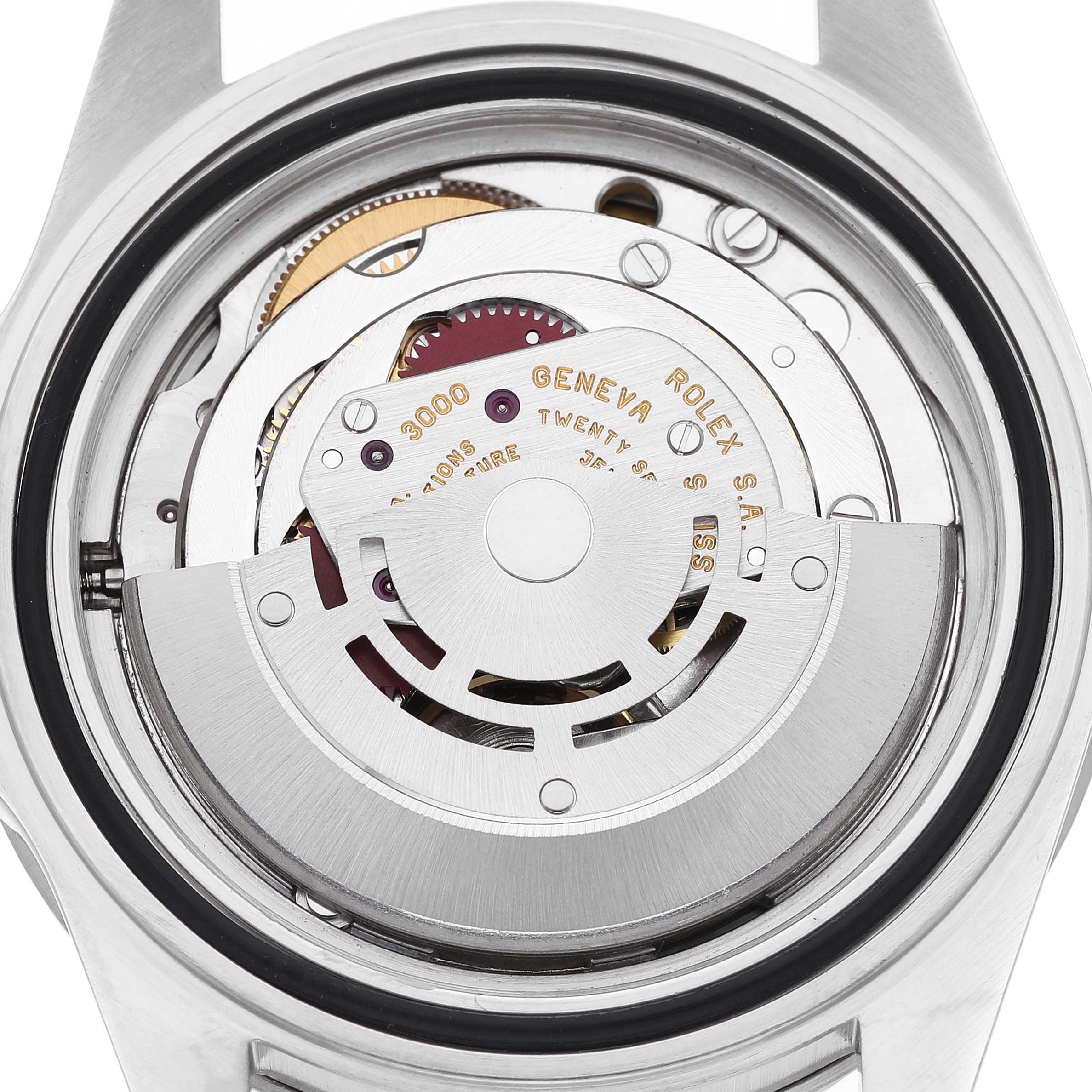 The image shows the internal mechanism of a Rolex Submariner 14060 Men's Stainless Steel Black Dial watch viewed from the back, highlighting the rotor and movement components.