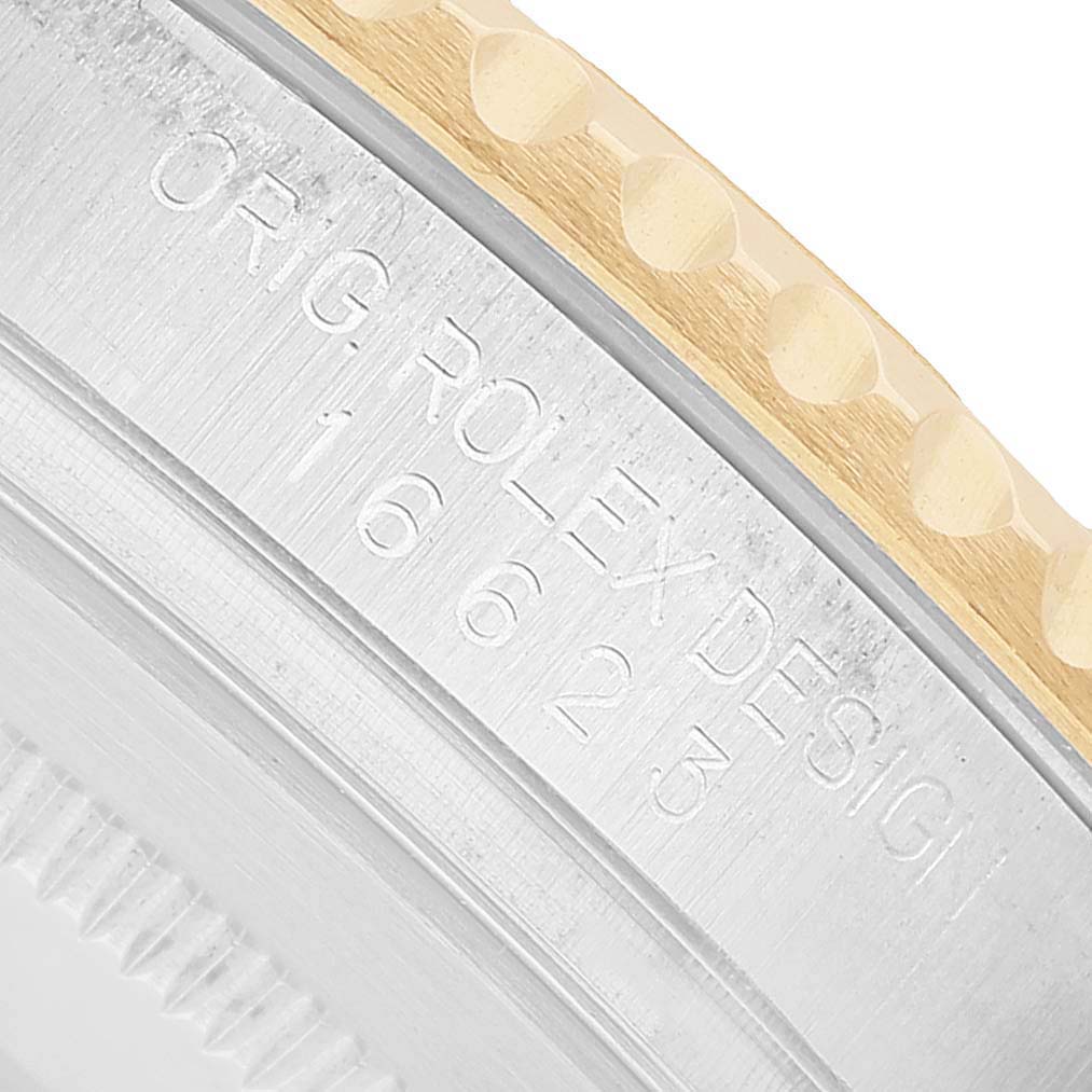 The image shows a close-up of the Yacht-Master by Rolex, focusing on the engraved edge and part of the bezel.