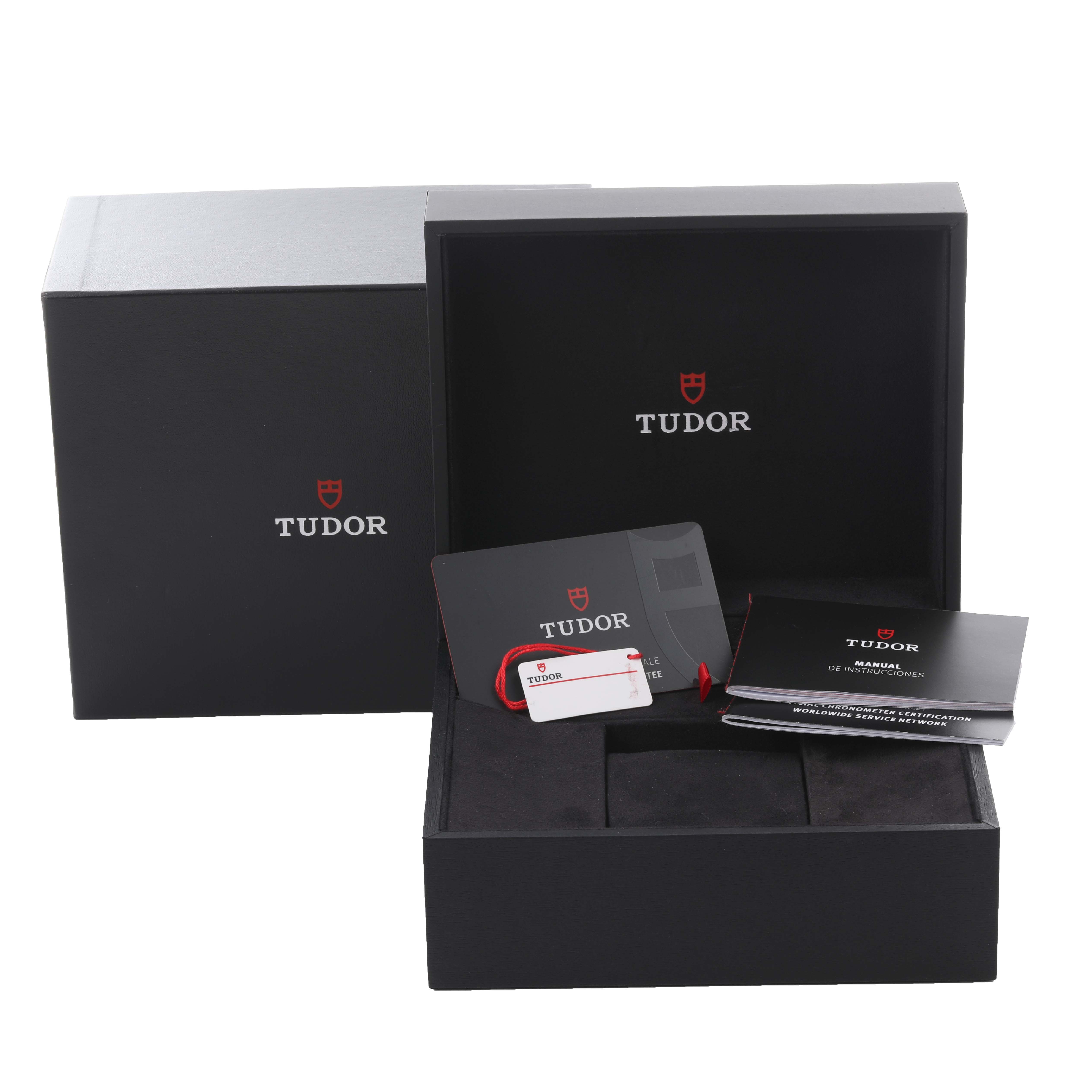 This image shows the packaging and accessories for the Tudor Heritage Black Bay 79833MN Men's Steel and Gold (two tone) Black Dial 79833MN Men's Steel and Gold (two tone) Black Dial, including the box, warranty card, and manual.