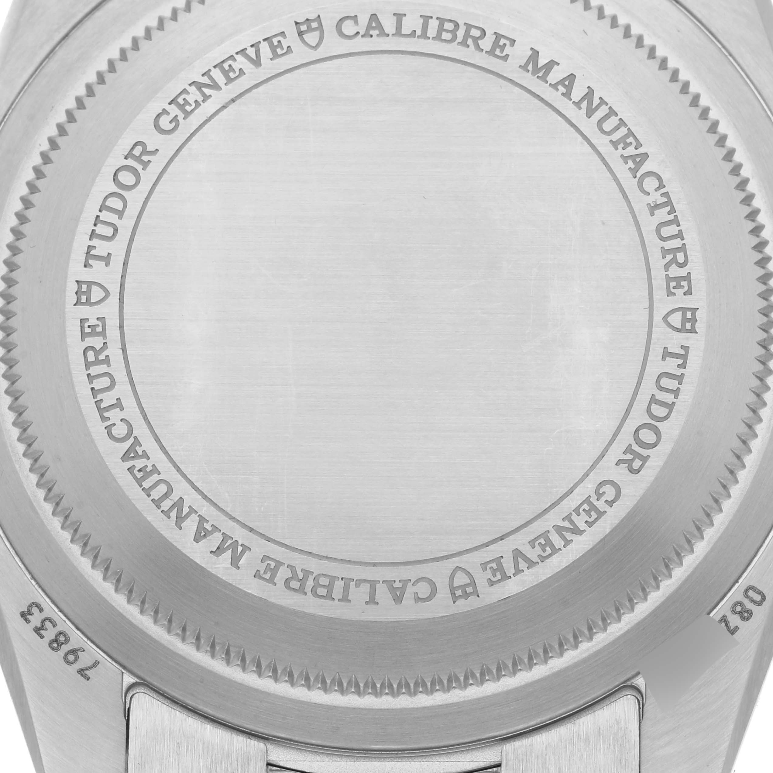 The image shows the back case of the Tudor Heritage Black Bay 79833MN Men's Steel and Gold (two tone) Black Dial 79833MN Men's Steel and Gold (two tone) Black Dial watch, highlighting engravings and the metal finish.