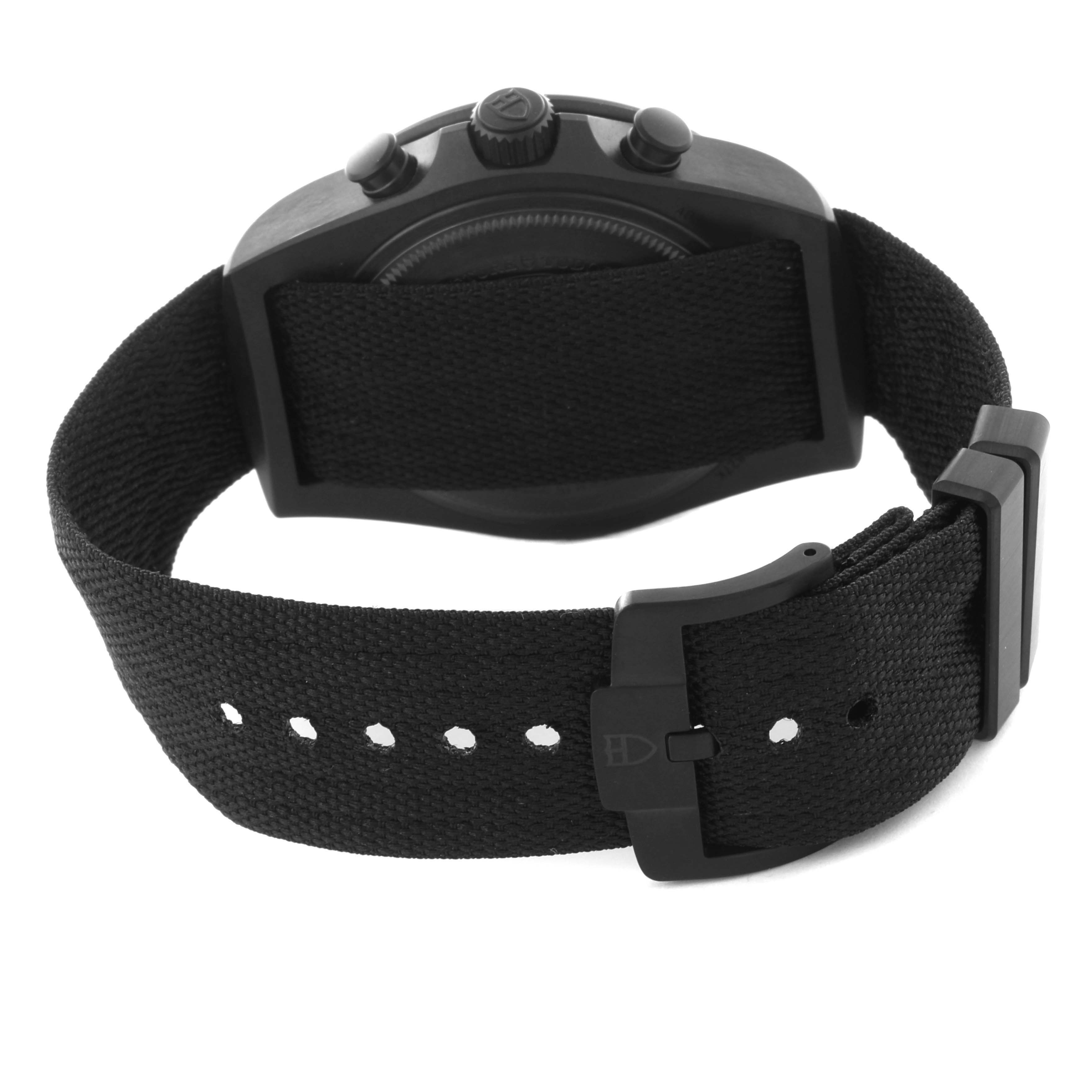 The image shows the Tudor Pelagos 25827KN Men
s Ceramic Black Dial 25827KN Men
s Ceramic Black Dial watch from the back, highlighting its black strap, clasp, and caseback.