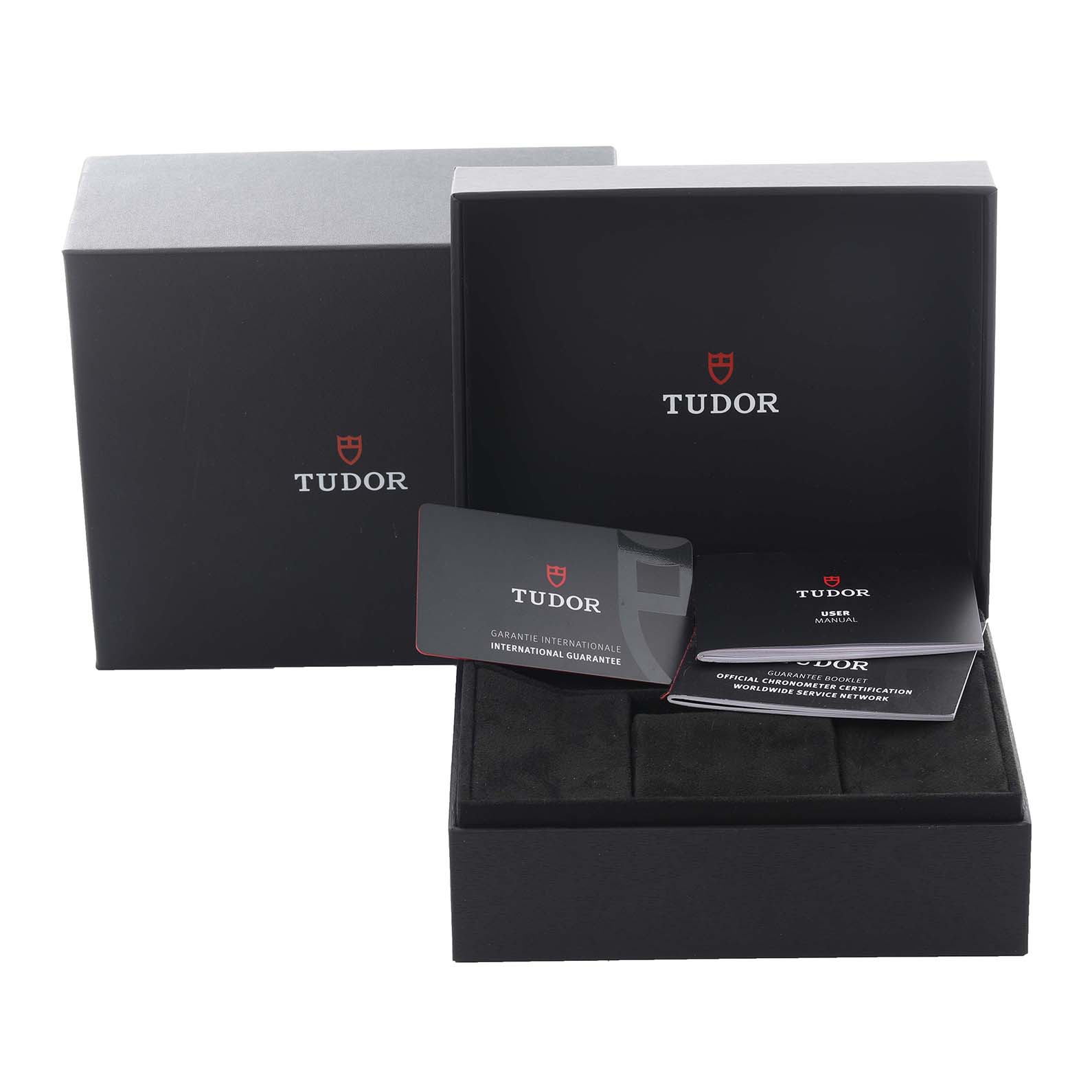 The image shows the packaging and accessories for a Tudor Pelagos 25827KN Men
s Ceramic Black Dial 25827KN Men
s Ceramic Black Dial watch, including a box, warranty card, and manuals.