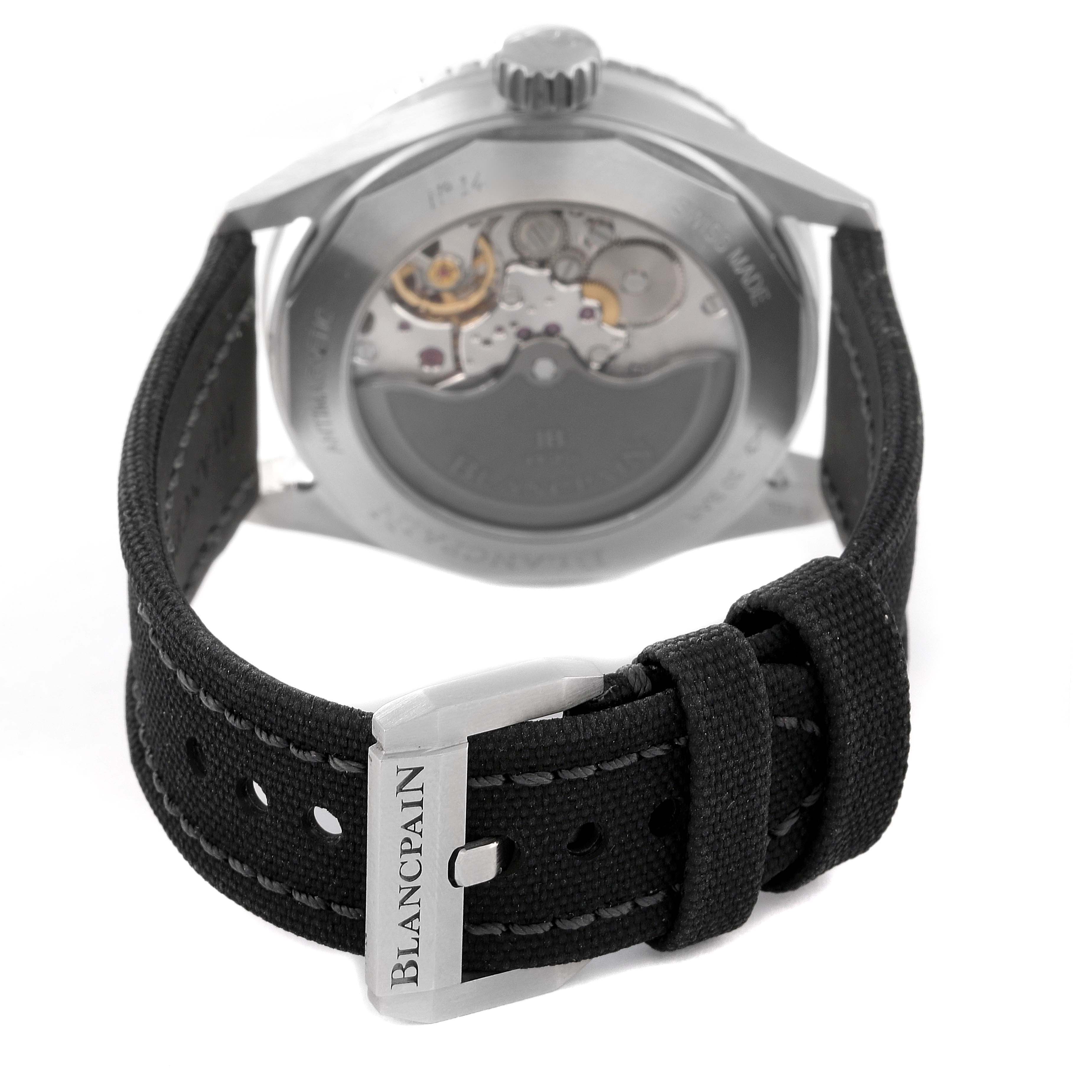 The image shows the Blancpain Fifty Fathoms 5000-1110-B52A Men's Stainless Steel Grey Dial 5000-1110-B52A Men's Stainless Steel Grey Dial watch from the back, highlighting the buckle and transparent case back displaying mechanical parts.