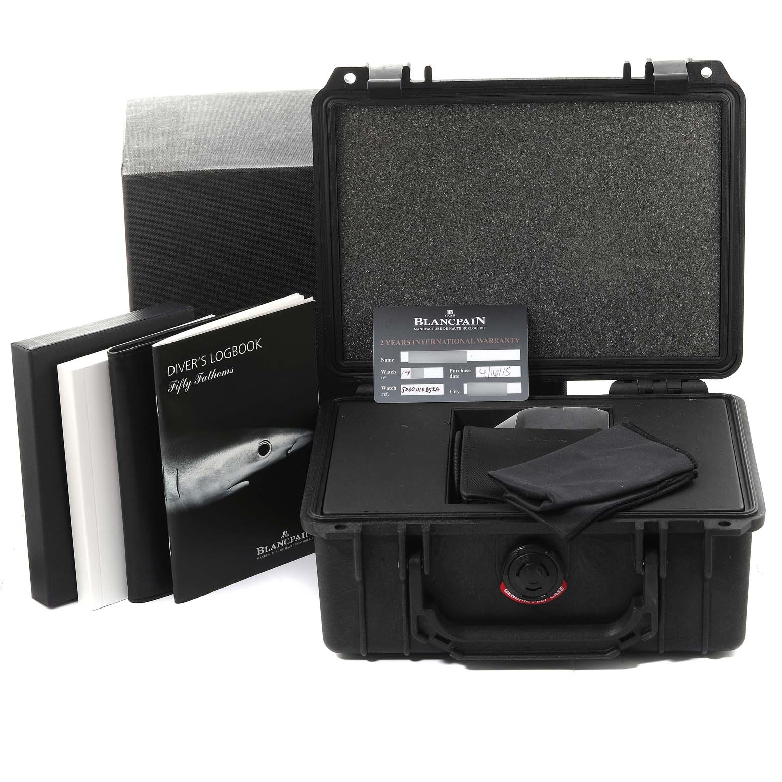 The image shows accessories of the Blancpain Fifty Fathoms 5000-1110-B52A Men's Stainless Steel Grey Dial 5000-1110-B52A Men's Stainless Steel Grey Dial watch, including a hard case, diver's logbook, warranty card, and cloths.