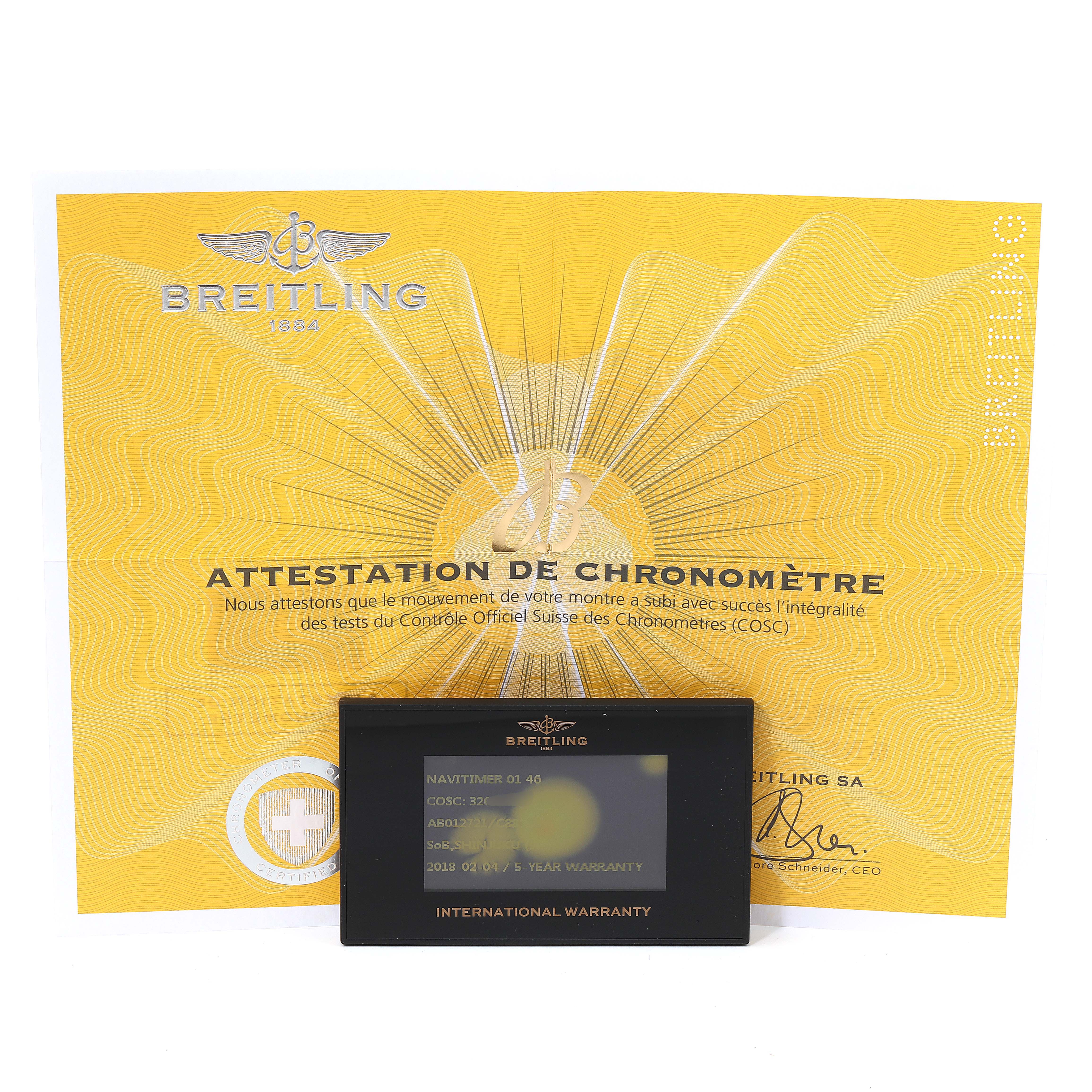 The image shows a Breitling Navitimer AB012721-C889-453A Men's Stainless Steel Blue Dial AB012721-C889-453A Men's Stainless Steel Blue Dial model's certificate of authenticity and international warranty card from a front angle.