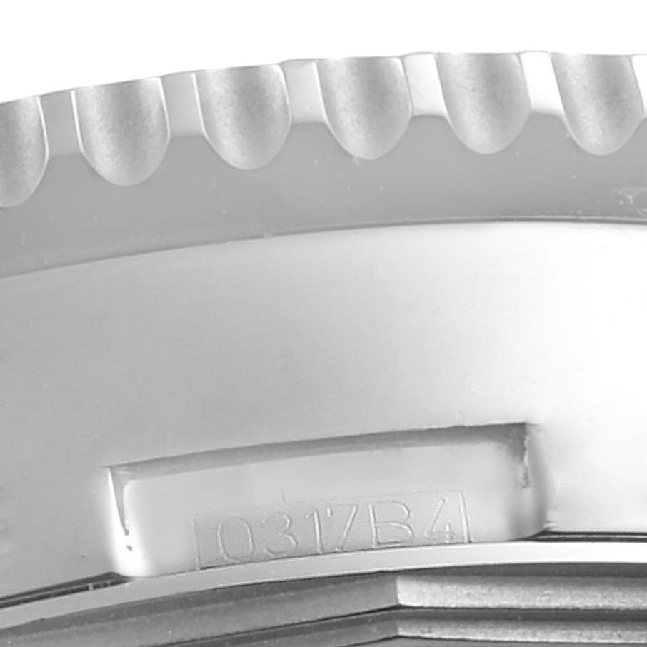 This image shows a close-up of the side bezel with grooves of a Breitling Navitimer AB012721-C889-453A Men's Stainless Steel Blue Dial AB012721-C889-453A Men's Stainless Steel Blue Dial watch.