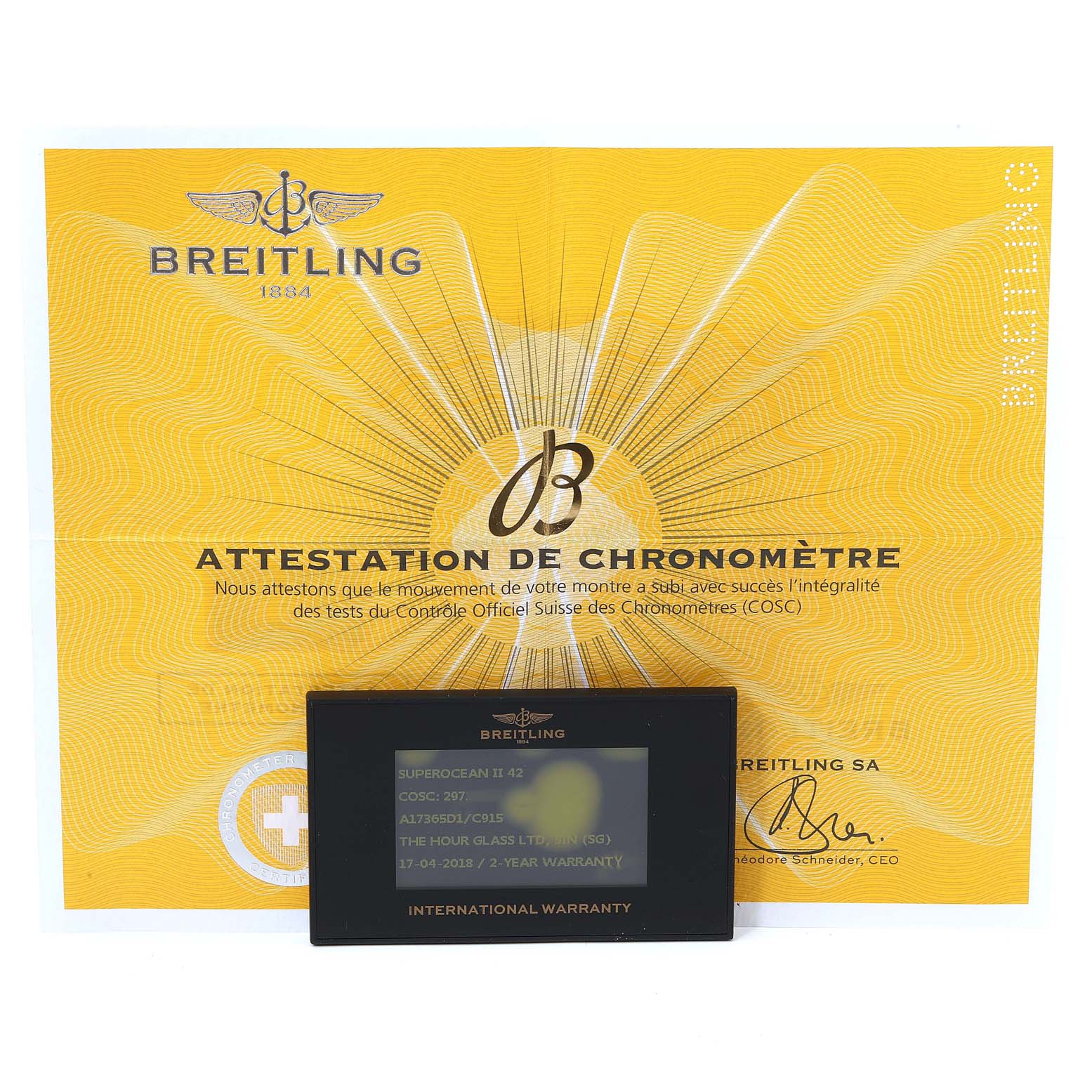 The image shows a Breitling Superocean A17391 Men's Stainless Steel Blue Dial A17391 Men's Stainless Steel Blue Dial model warranty card and COSC certification document.