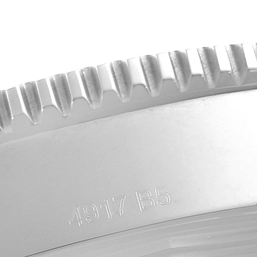 The image shows a close-up of the Superocean model by Breitling, focusing on the bezel and part of the watch case.