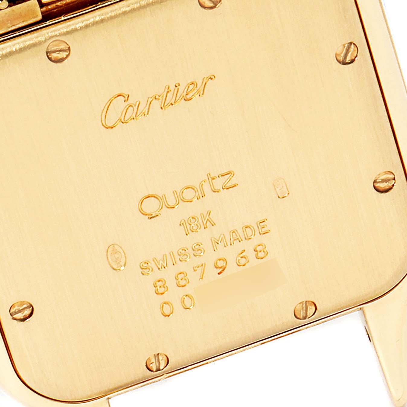 The image shows the back case of a Cartier Panthere W25014B9 Men's Yellow Gold Silver Dial W25014B9 Men's Yellow Gold Silver Dial watch, highlighting its engravings and screws.