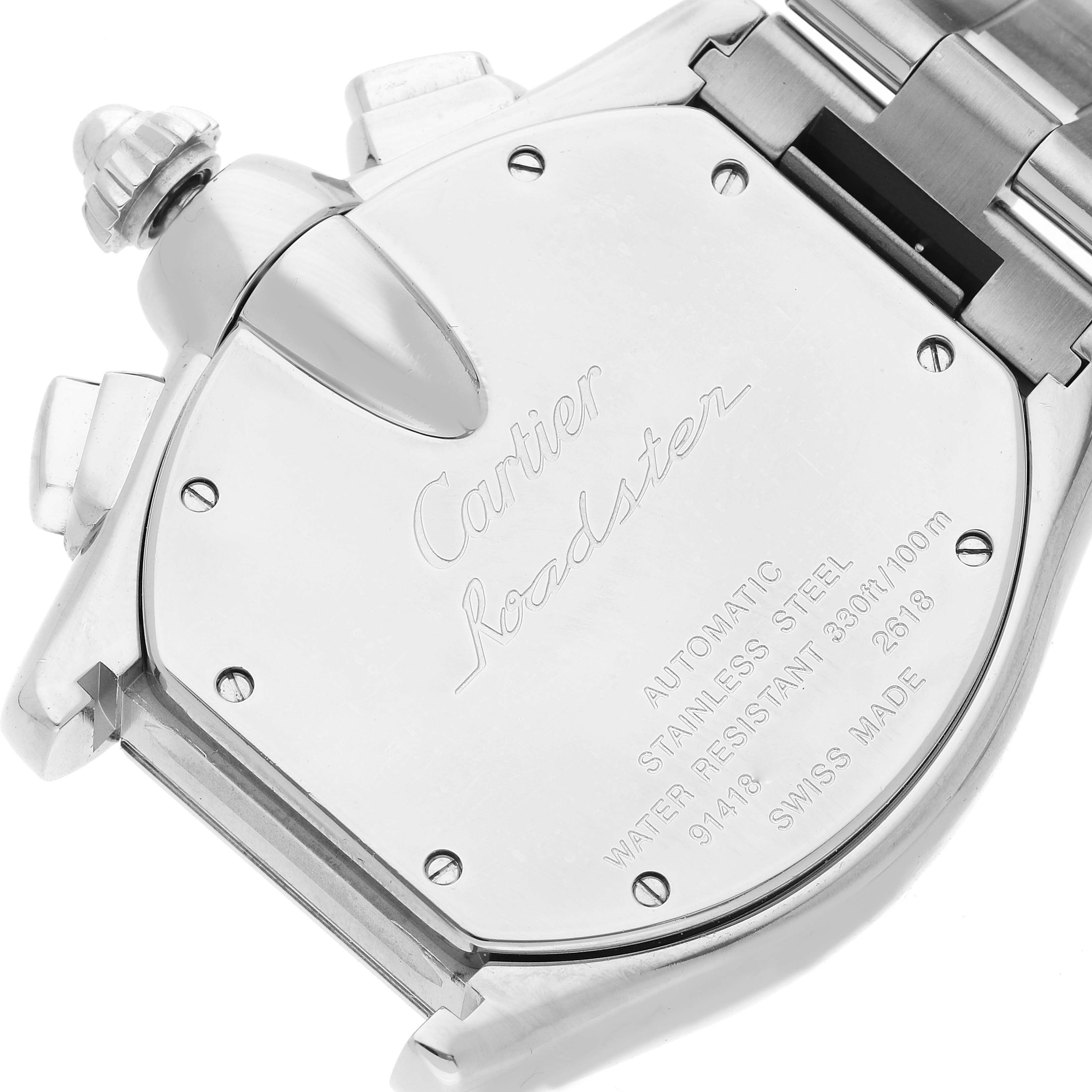The image shows the back case of a Cartier Roadster W62019X6 Men's Stainless Steel Silver Dial W62019X6 Men's Stainless Steel Silver Dial watch at an angled view, highlighting the inscriptions and metal links.