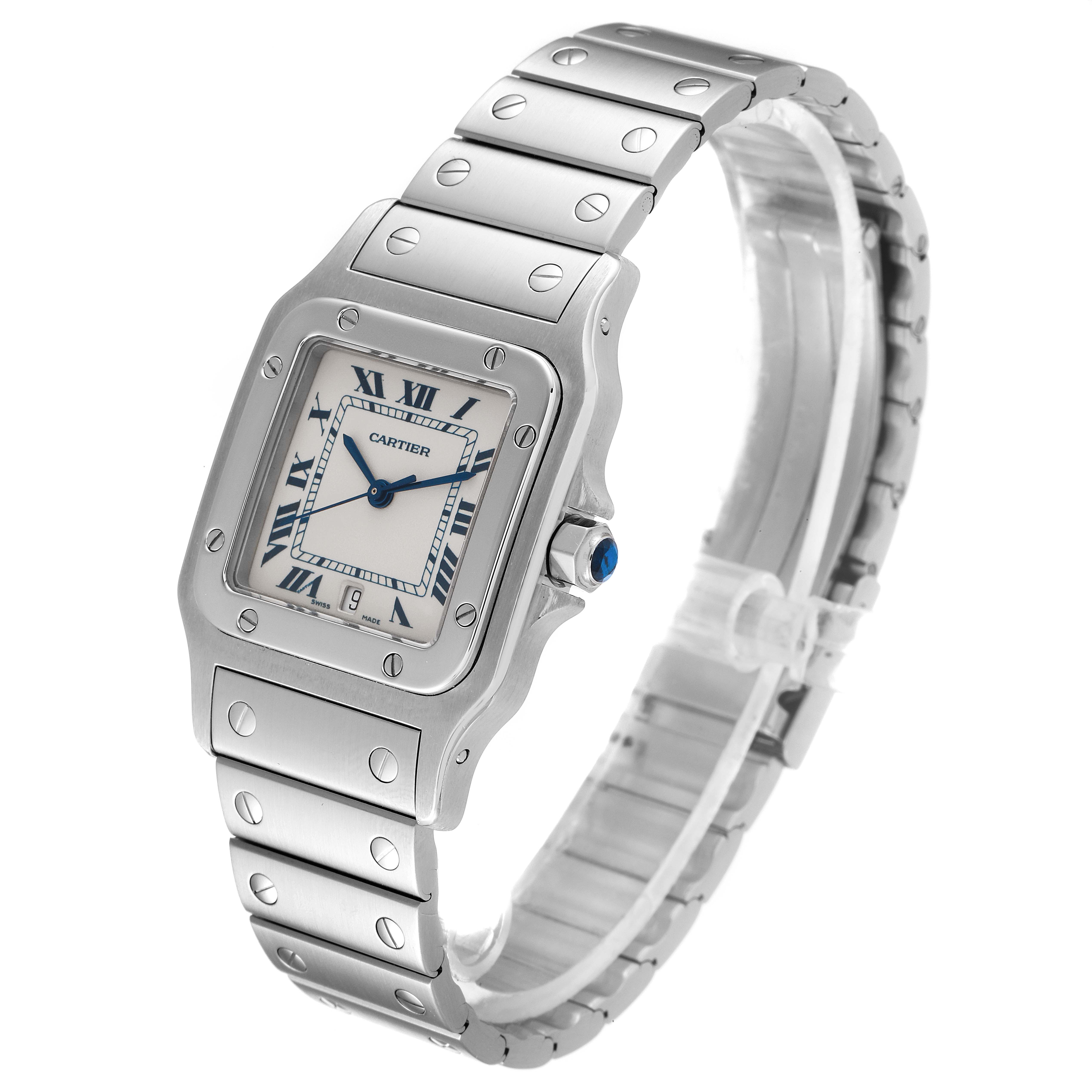 The image shows a Cartier Santos W20060D6 Men
s Stainless Steel Silver Dial W20060D6 Men
s Stainless Steel Silver Dial watch with a silver case, bezel, blue hands, Roman numerals, and a metal bracelet, angled from the front-left side.