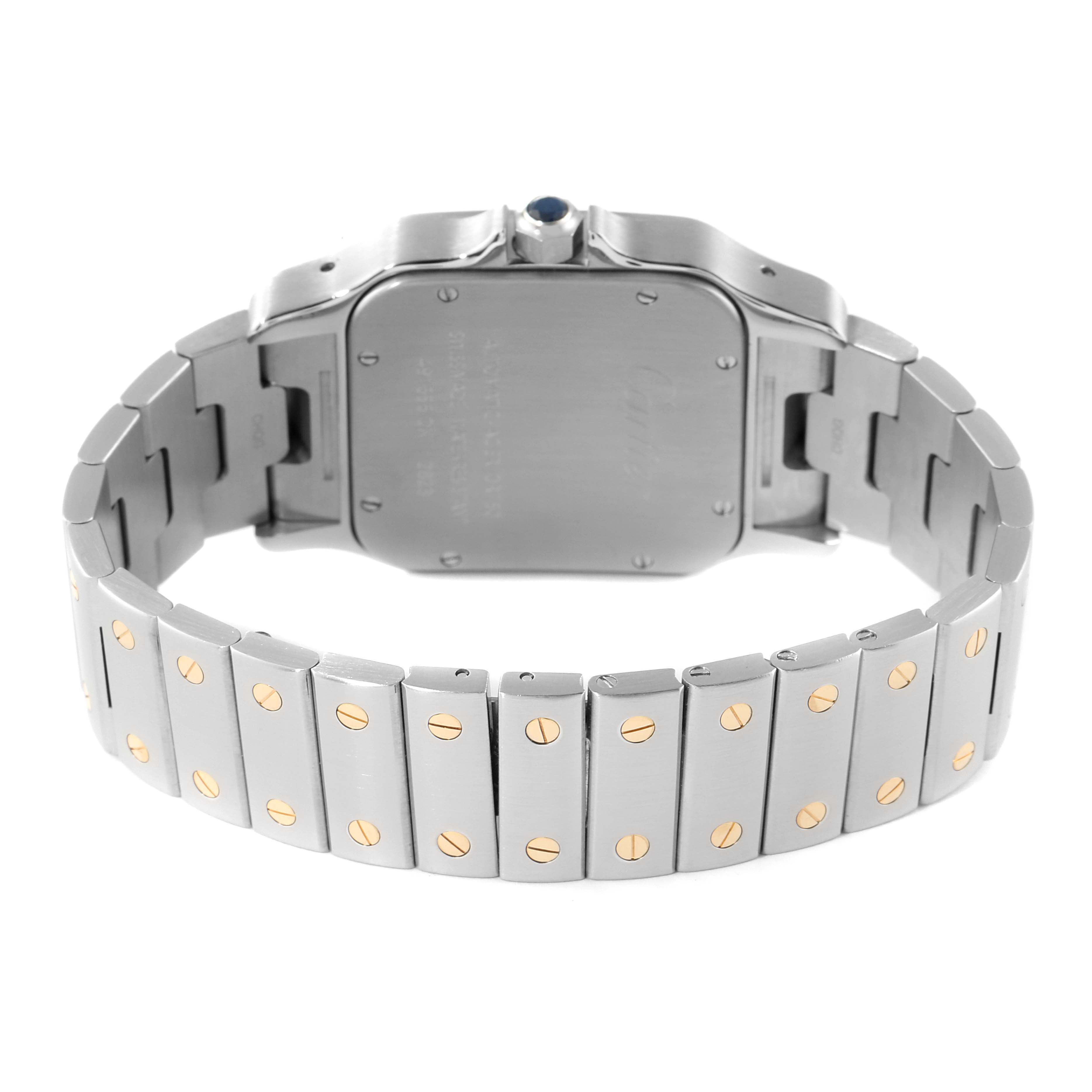 The image shows the back view of a Cartier Santos W20099C4 Men
s Steel and Gold (two tone) Silver Dial W20099C4 Men
s Steel and Gold (two tone) Silver Dial watch, highlighting the case back and metal bracelet with gold screws.