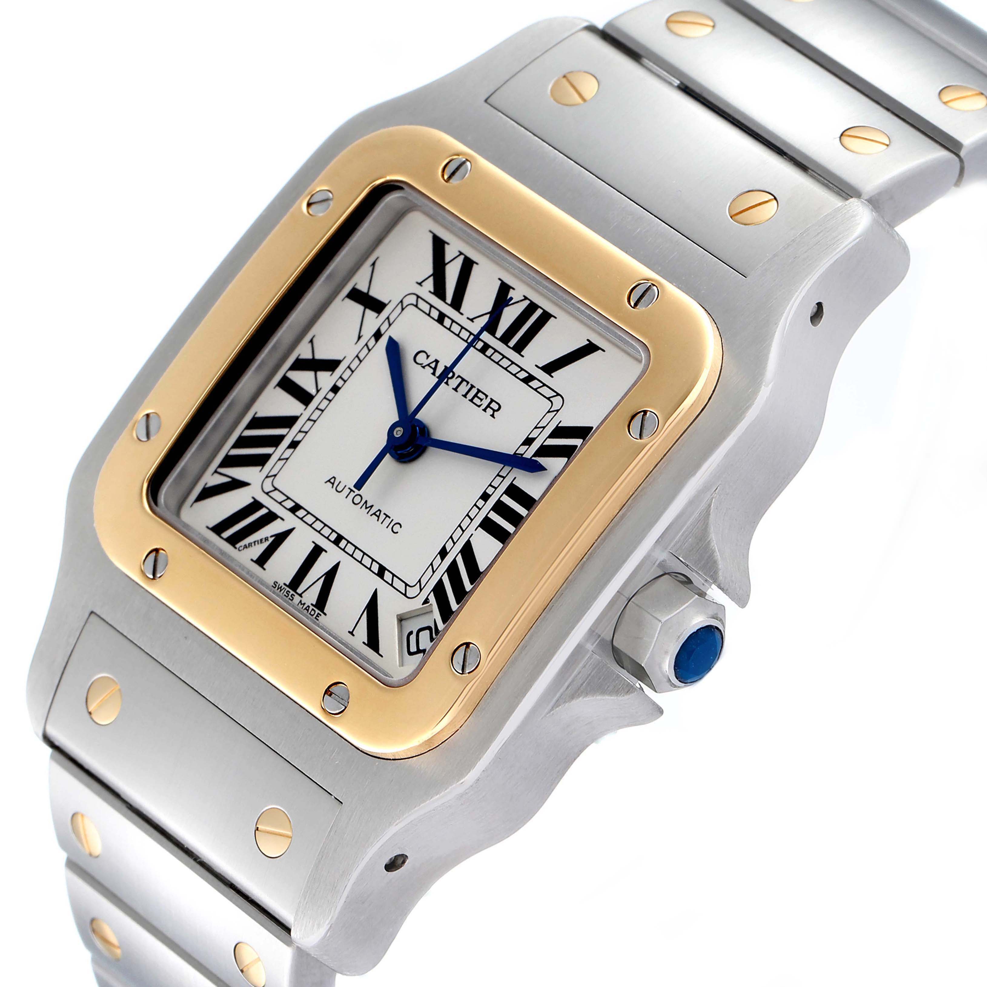 This image shows an angled view of the Cartier Santos W20099C4 Men
s Steel and Gold (two tone) Silver Dial W20099C4 Men
s Steel and Gold (two tone) Silver Dial watch, highlighting its square face, bezel, crown, and bracelet.