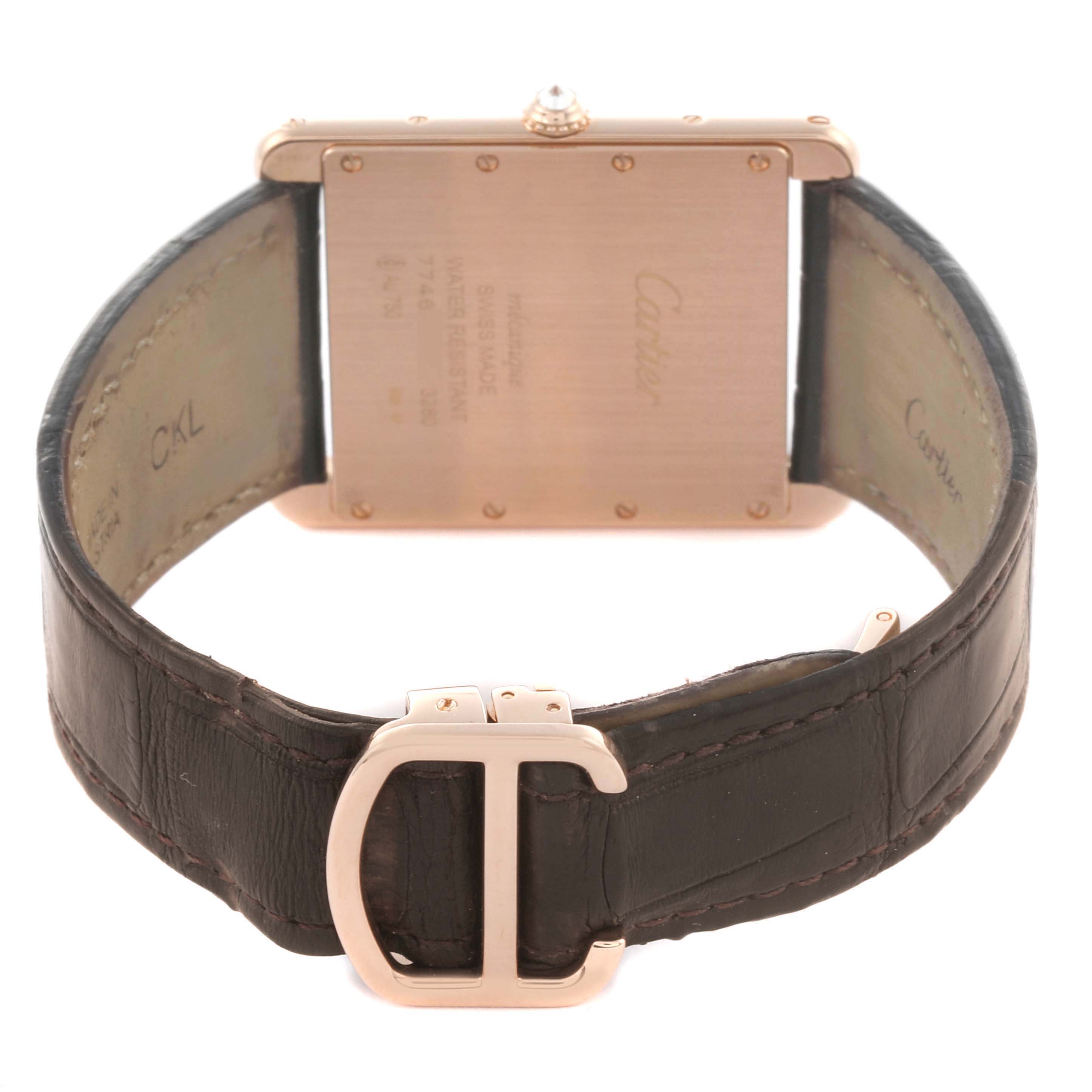 The image shows the back of the Cartier Tank Louis WT200005 Men's Rose Gold Silver Dial watch, highlighting the case back, strap, and clasp.