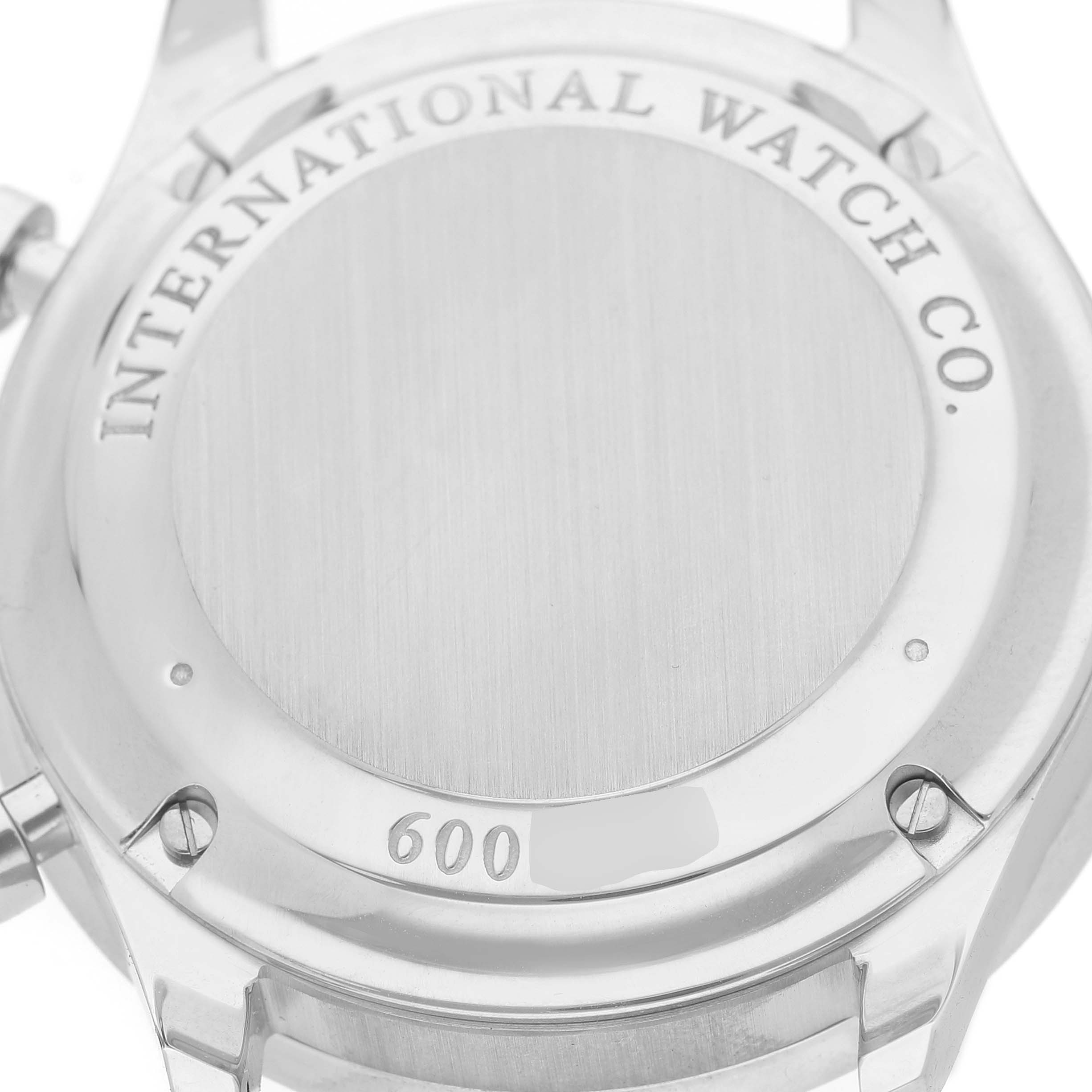 The image shows the stainless steel back of an IWC Portuguese IW371447 Men's Stainless Steel Black Dial watch, highlighting the brand engraving.