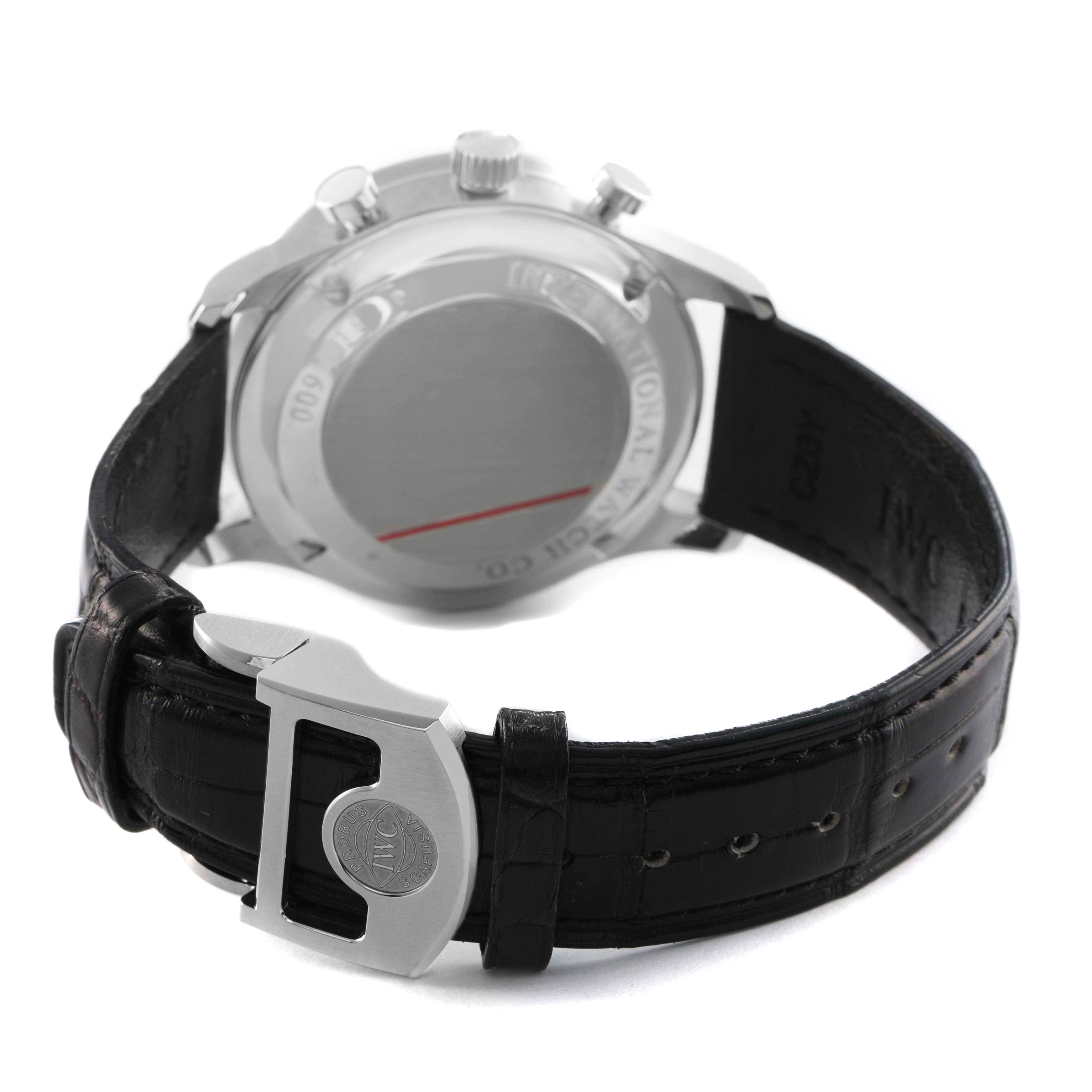 The IWC Portuguese IW371447 Men's Stainless Steel Black Dial watch is shown from the rear, highlighting the case back, clasp, and leather strap.