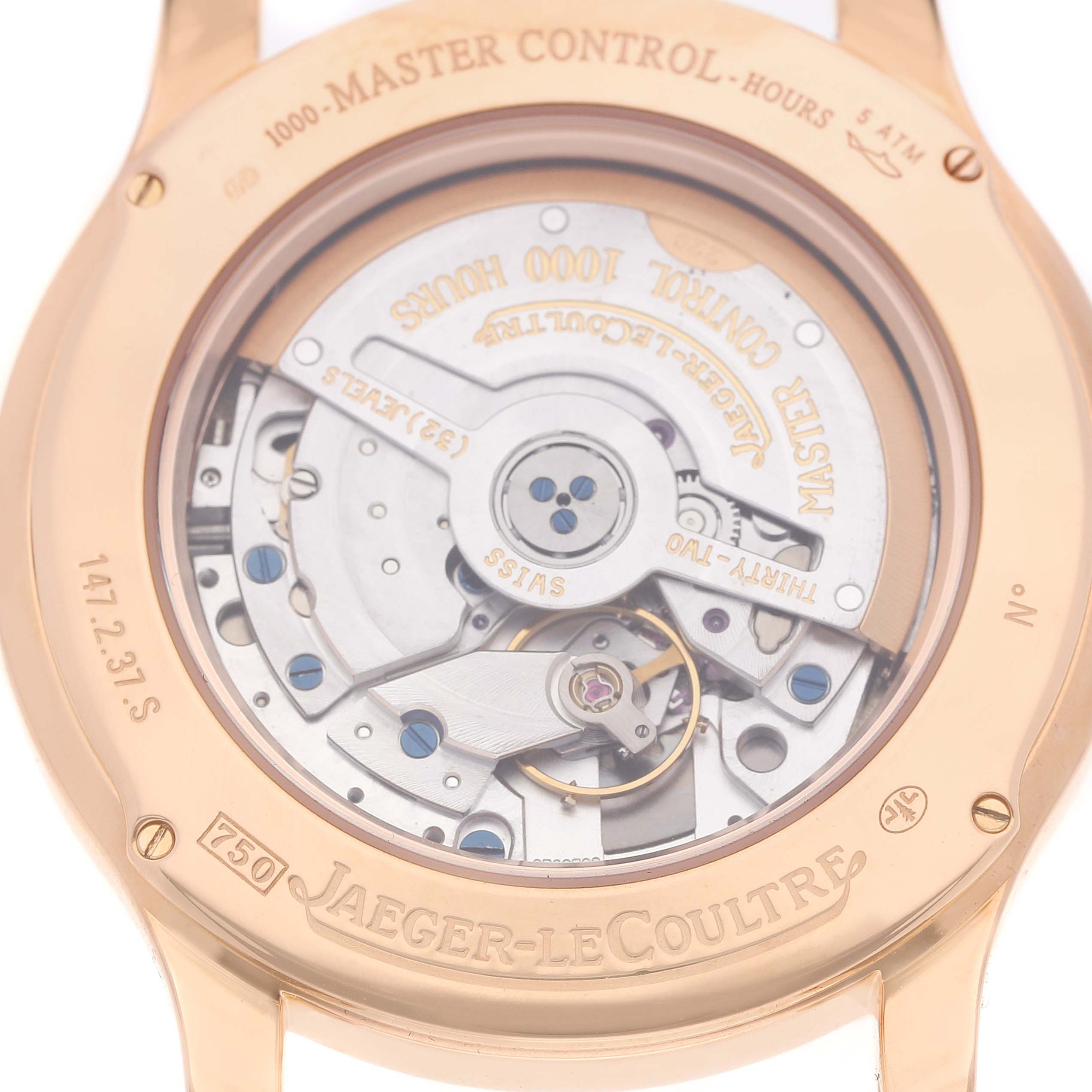The image shows the back of a Jaeger-LeCoultre Master model watch, highlighting the internal movement and engravings.