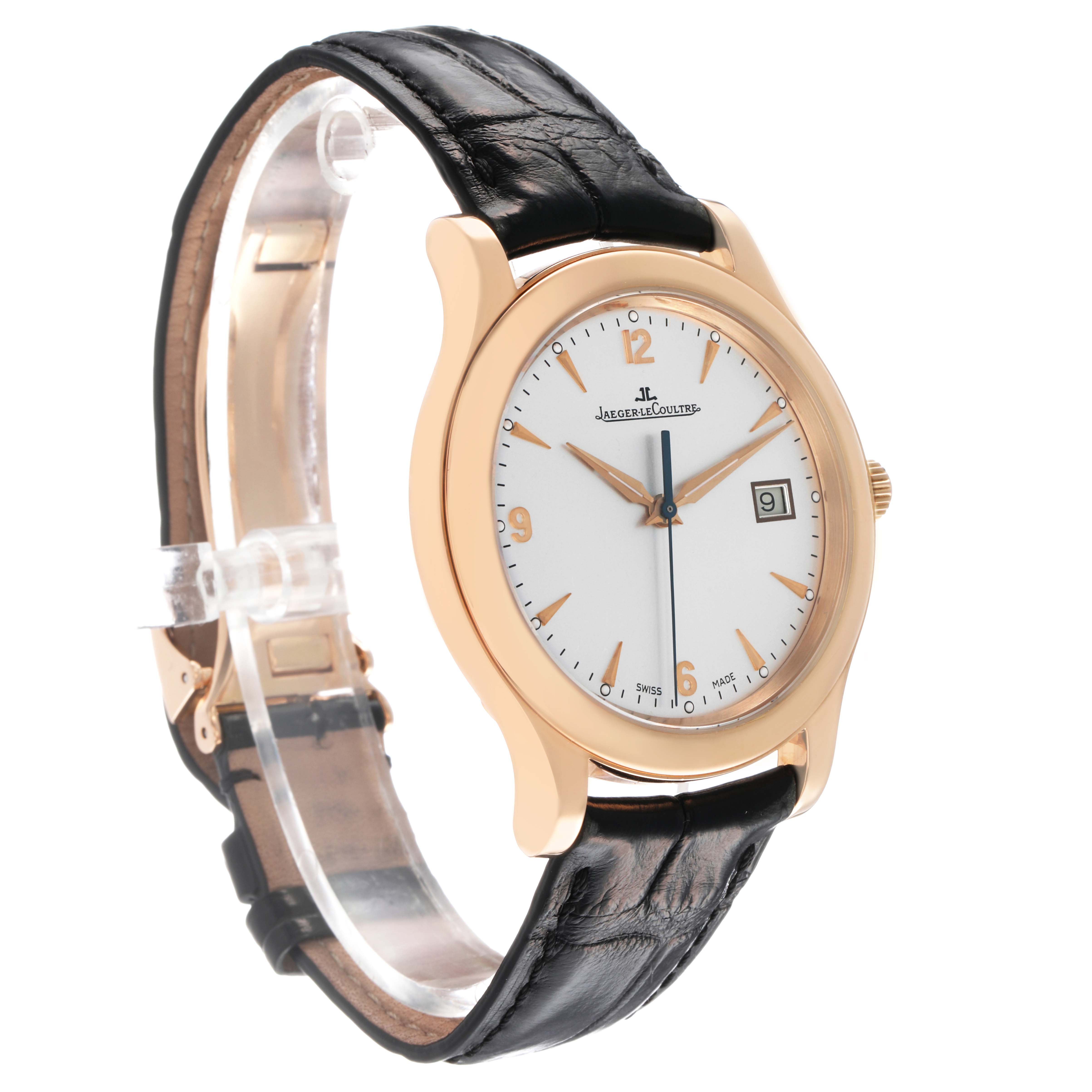 The Jaeger-LeCoultre Master watch is shown at a slight angle, displaying its dial, gold case, and black leather strap.