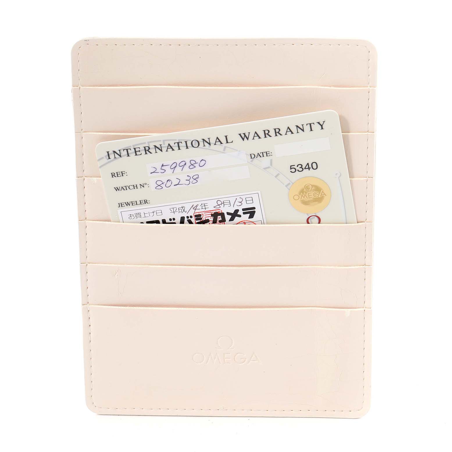 The image shows an Omega Seamaster 2599.80.00 Men's Stainless Steel Blue Dial 2599.80.00 Men's Stainless Steel Blue Dial International Warranty card in a beige cardholder.