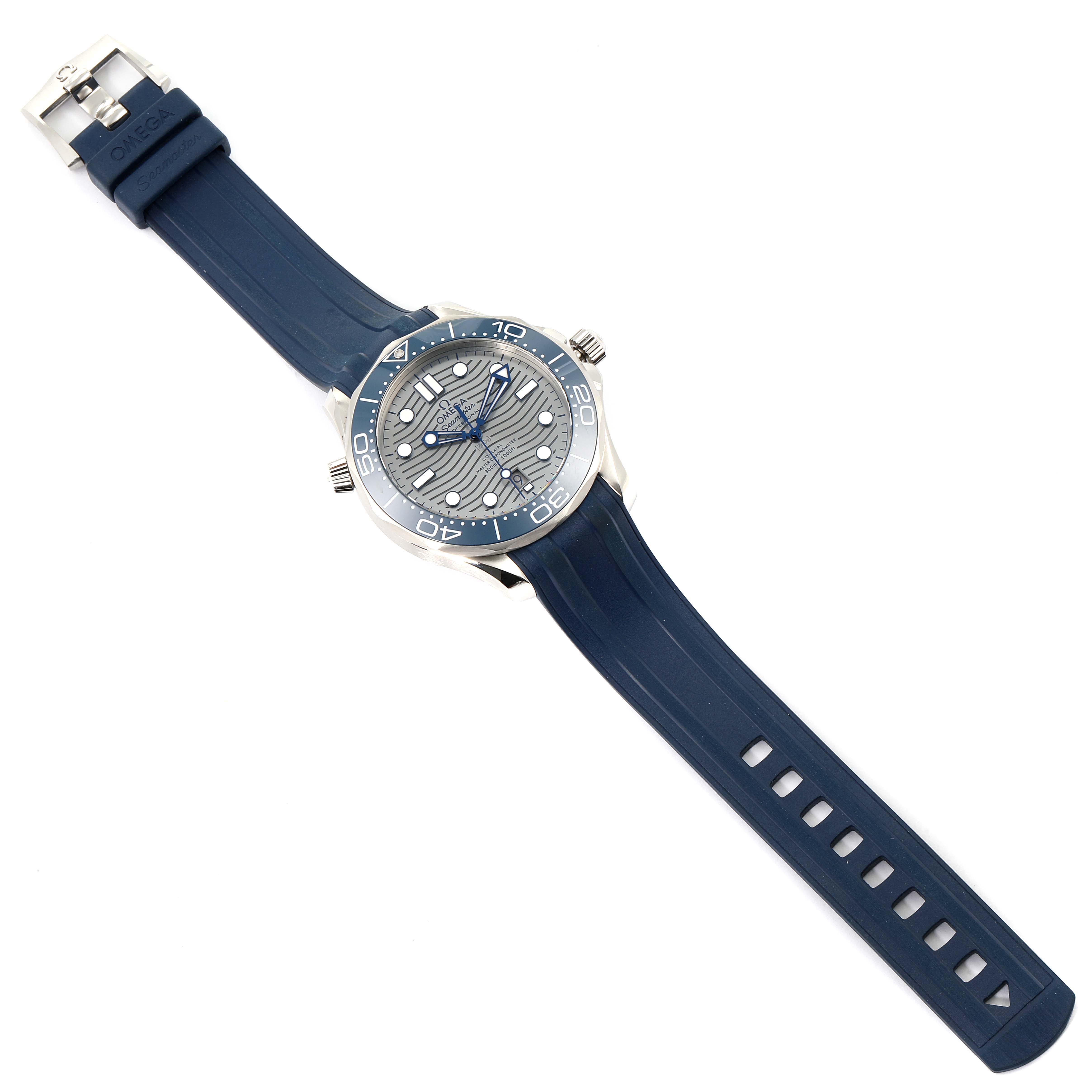 The image shows an overhead view of an Omega Seamaster 210.32.42.20.06.001 Men
s Stainless Steel Grey Dial 210.32.42.20.06.001 Men
s Stainless Steel Grey Dial watch with a blue rubber strap and a silver bezel.
