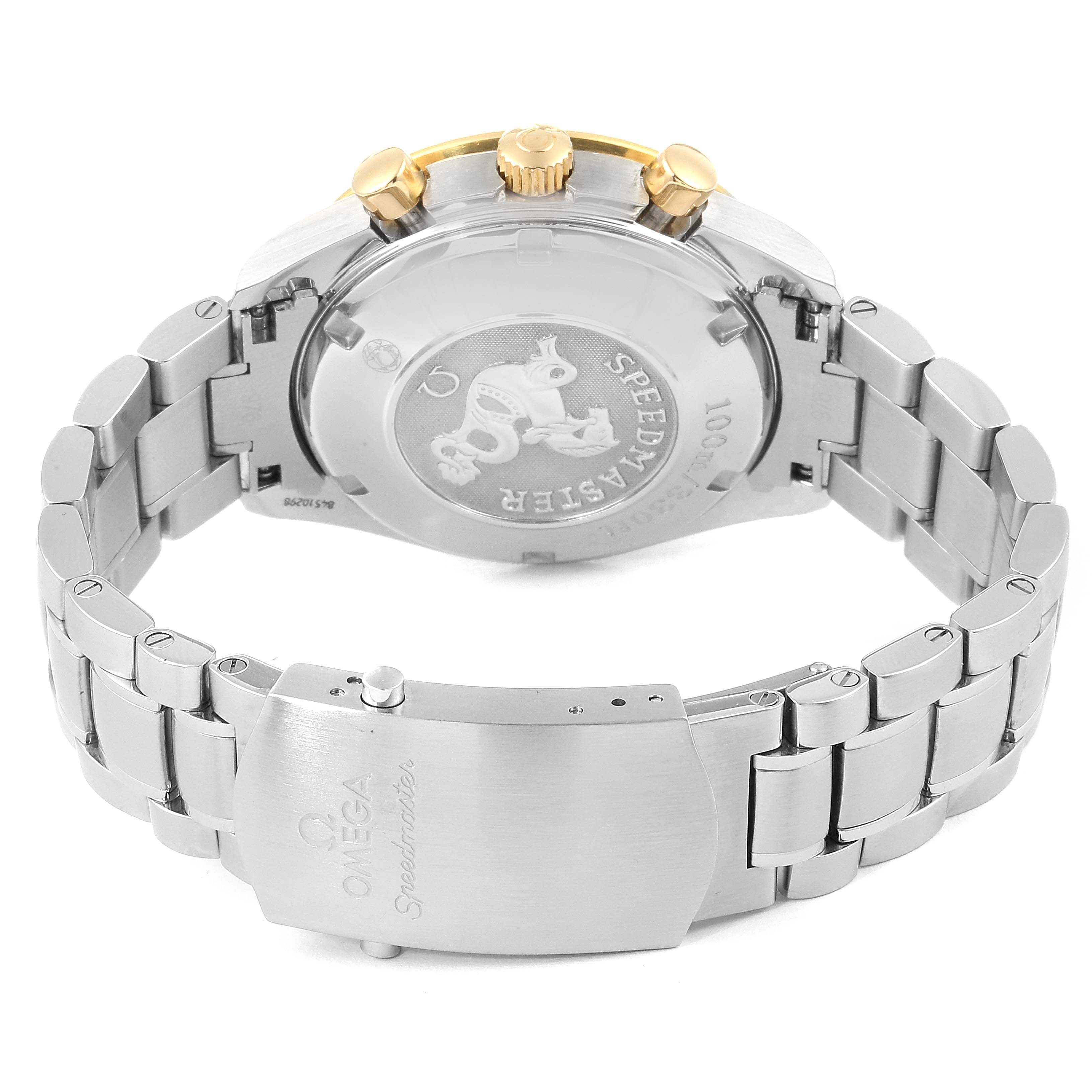 The image shows the back of an Omega Speedmaster 323.21.40.44.02.001 Men's Steel and Gold (two tone) Silver Dial 323.21.40.44.02.001 Men's Steel and Gold (two tone) Silver Dial watch, highlighting the case back, bracelet, and clasp.