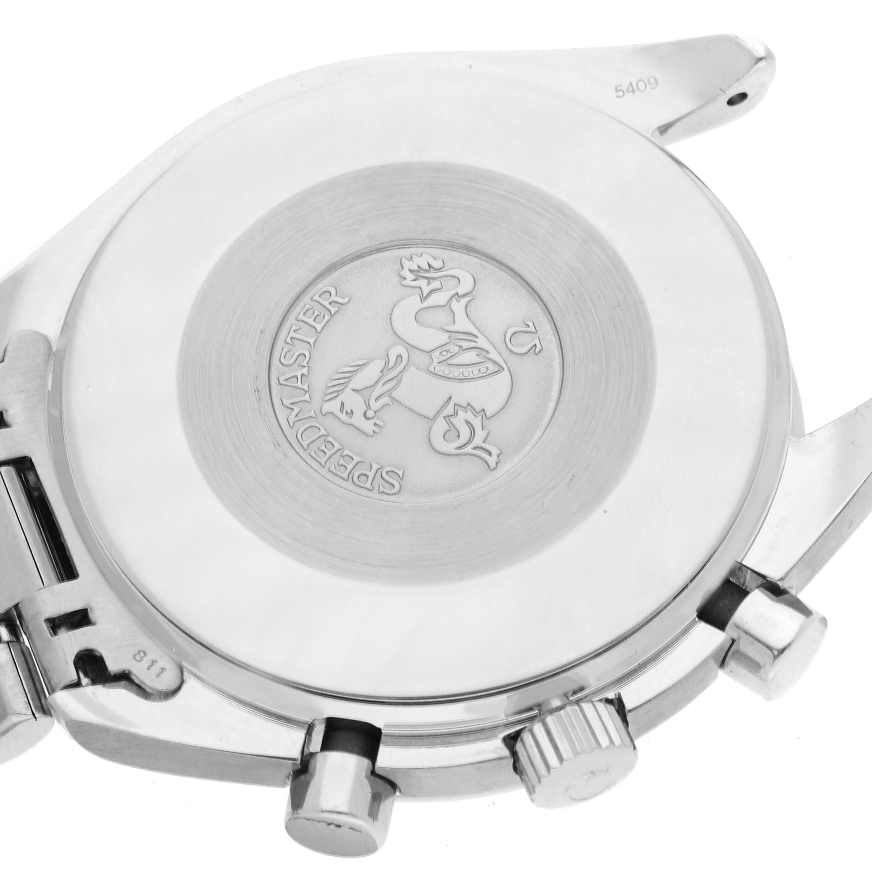 The image shows the back casing with an engraved emblem and side buttons of an Omega Speedmaster 3510.50.00 Men's Stainless Steel Black Dial 3510.50.00 Men's Stainless Steel Black Dial watch.