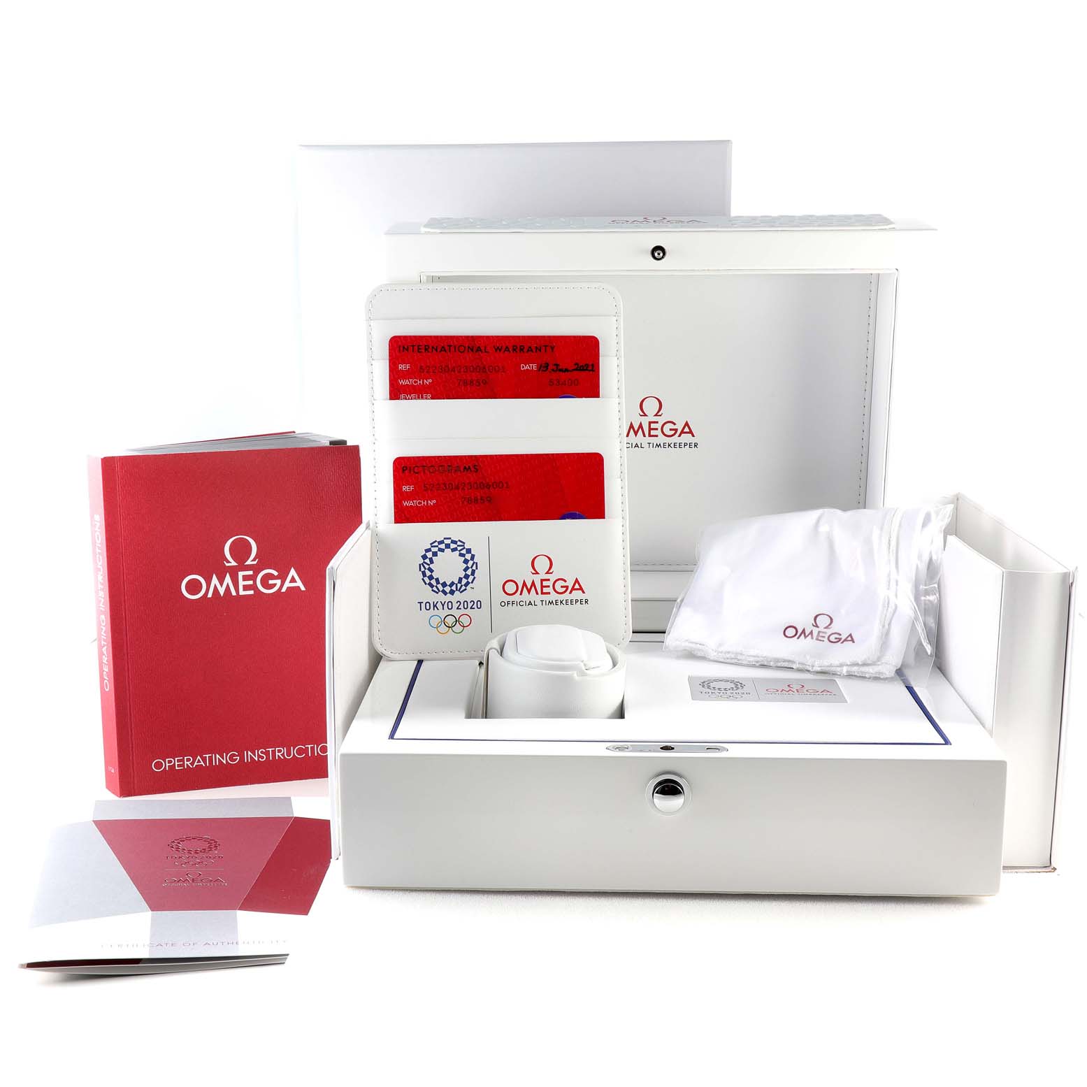 The image shows a set of Omega Speedmaster 522.30.42.30.06.001 Men's Stainless Steel Silver Dial 522.30.42.30.06.001 Men's Stainless Steel Silver Dial watch accessories, including a booklet, cards, and a watch case, viewed from the front.