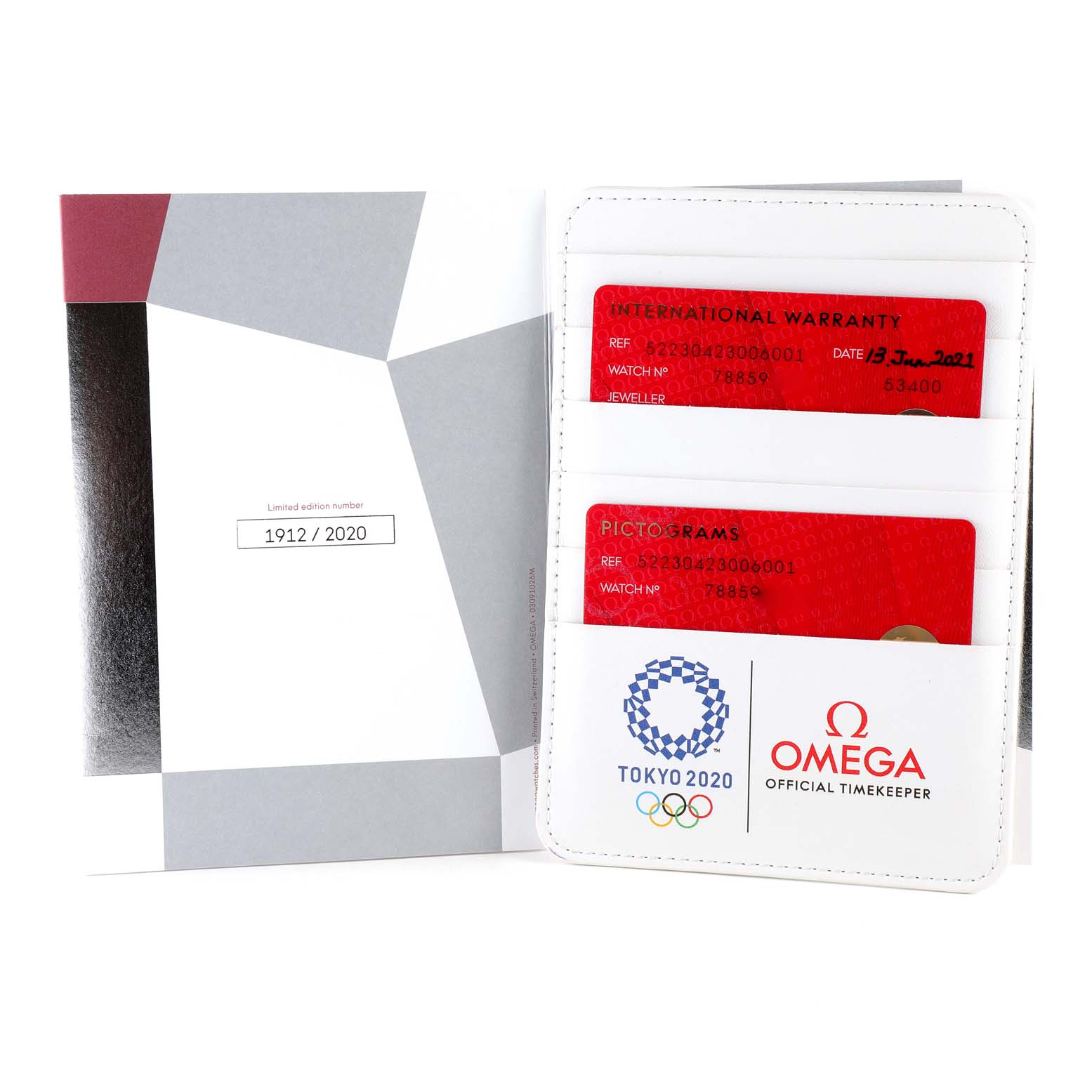 The image shows the warranty cards for an Omega Speedmaster 522.30.42.30.06.001 Men's Stainless Steel Silver Dial 522.30.42.30.06.001 Men's Stainless Steel Silver Dial watch, along with a holder and booklet indicating the limited edition number.