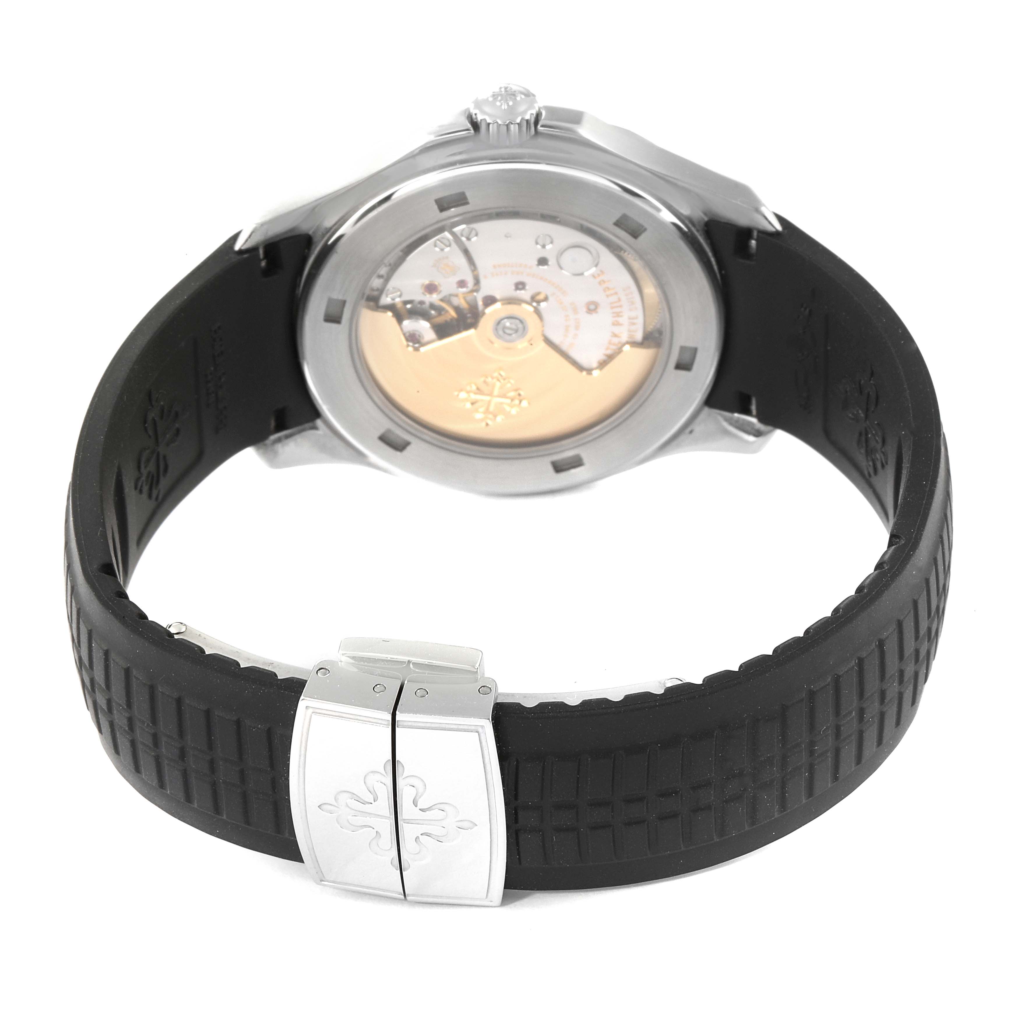The image shows the back view of a Patek Philippe Aquanaut 5165A-00 Men's Stainless Steel Black Dial 5165A-00 Men's Stainless Steel Black Dial, highlighting the clasp, rubber strap, and transparent case back.