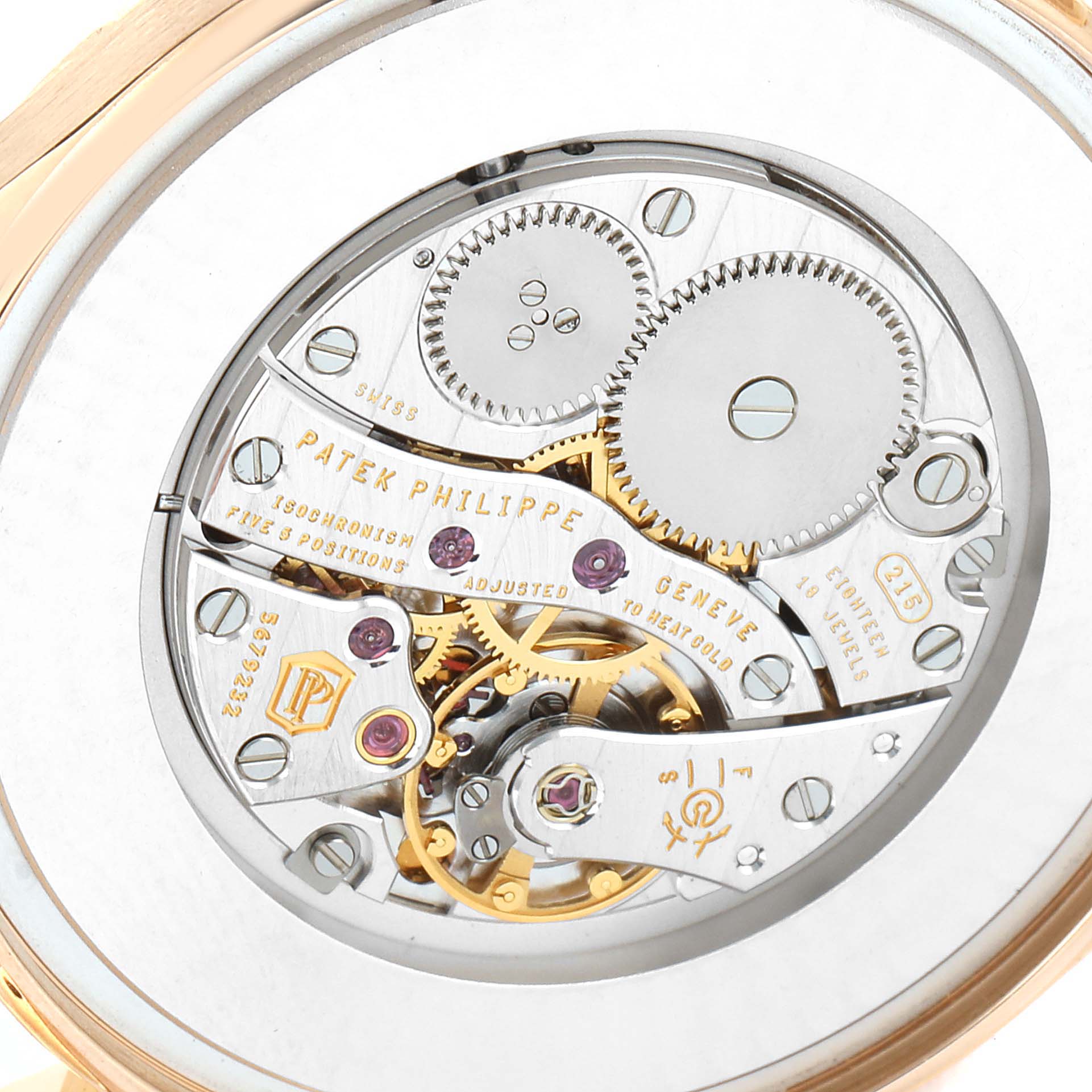 The image shows the intricate movement parts and inner mechanisms of a Patek Philippe Calatrava 5196R Men's Rose Gold Silver Dial 5196R Men's Rose Gold Silver Dial watch from a close-up rear angle.