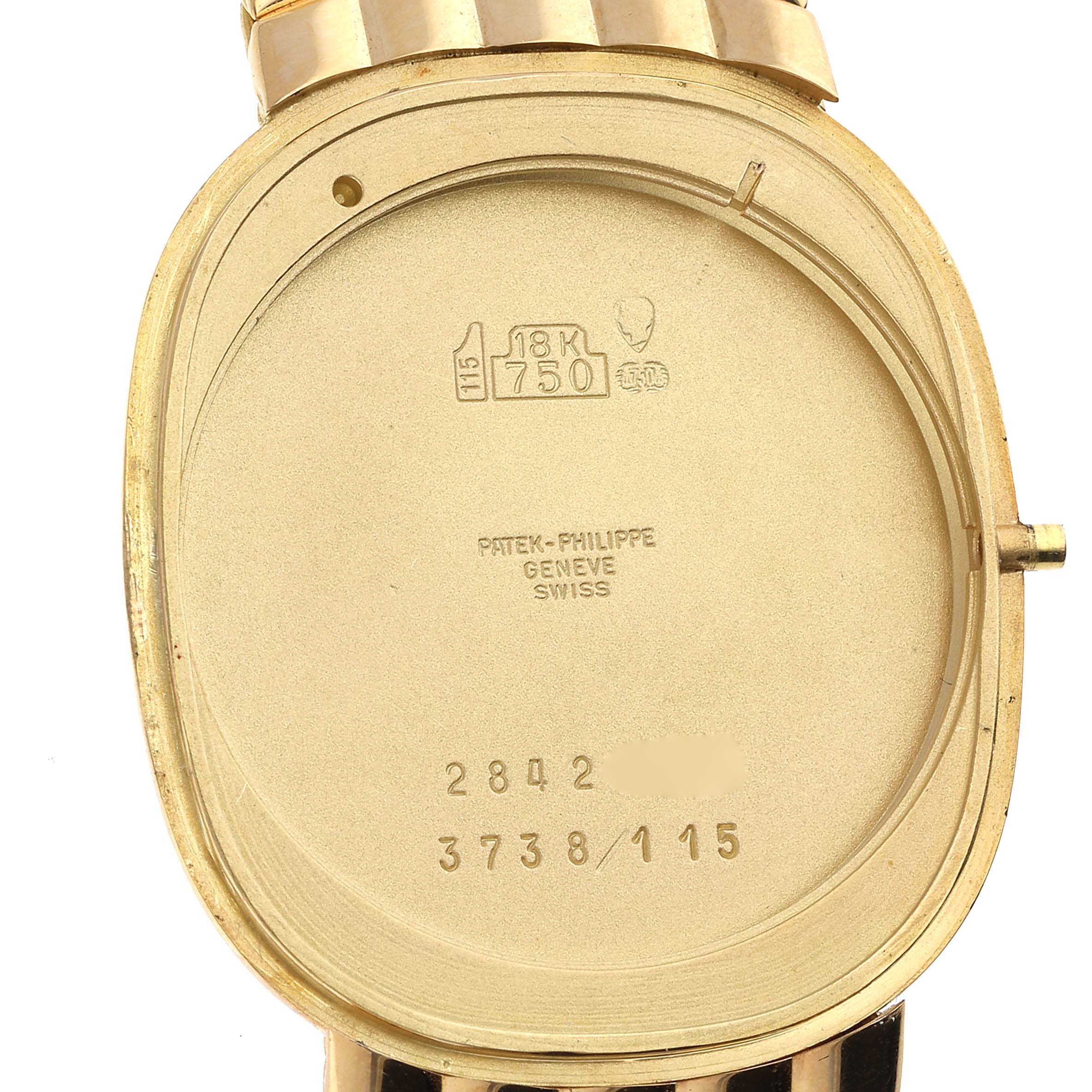 The image shows the back case of the Patek Philippe Golden Ellipse 3738 Men's Yellow Gold Blue Dial 3738 Men's Yellow Gold Blue Dial watch with inscriptions and hallmarks visible.