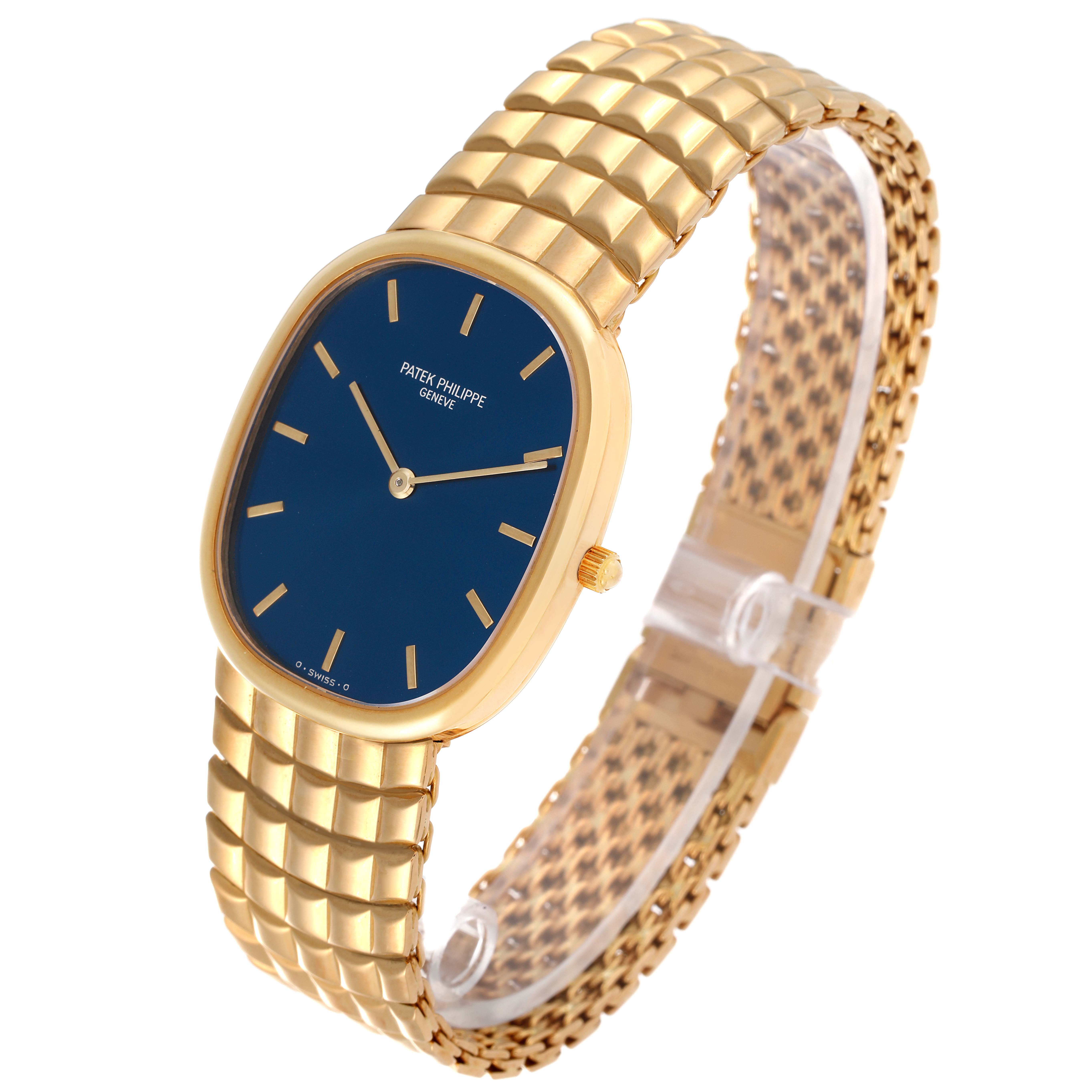 The image shows a Patek Philippe Golden Ellipse 3738 Men's Yellow Gold Blue Dial 3738 Men's Yellow Gold Blue Dial watch from a three-quarter angle, displaying the gold case, band, and blue dial.