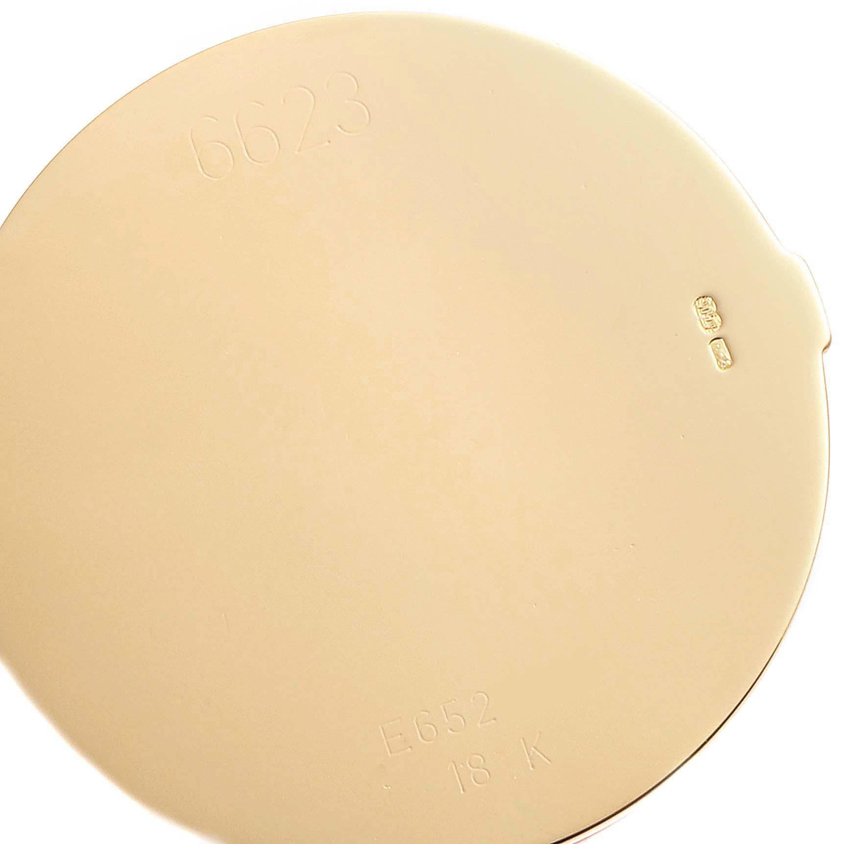 The image shows the back cover of a Rolex Cellini 6623 Men's Yellow Gold White Dial 6623 Men's Yellow Gold White Dial watch, featuring model and material inscriptions.