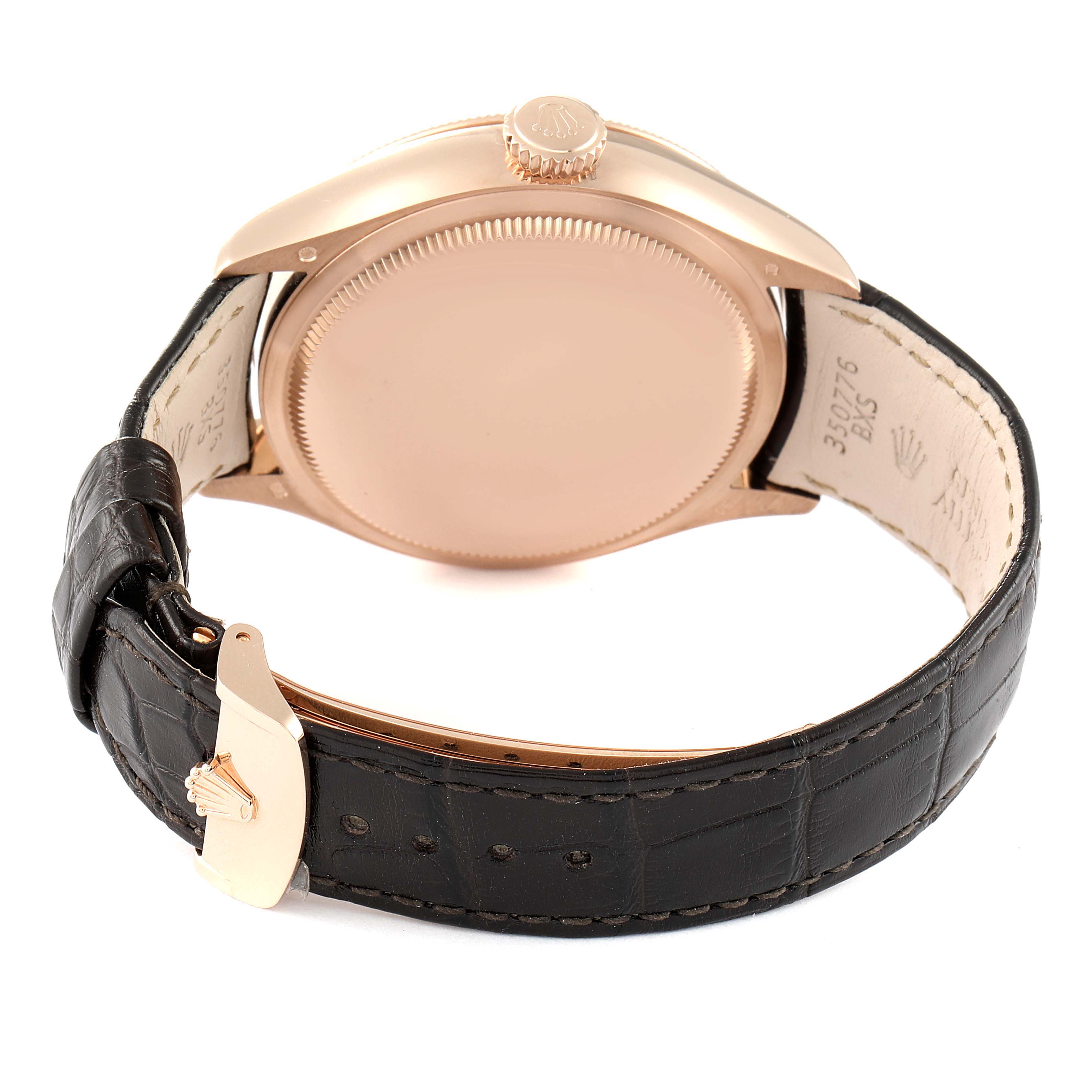The image shows the back view of a Rolex Cellini 50535 Men's Rose Gold White Dial 50535 Men's Rose Gold White Dial watch, highlighting its case, crown, and leather strap with a buckle.
