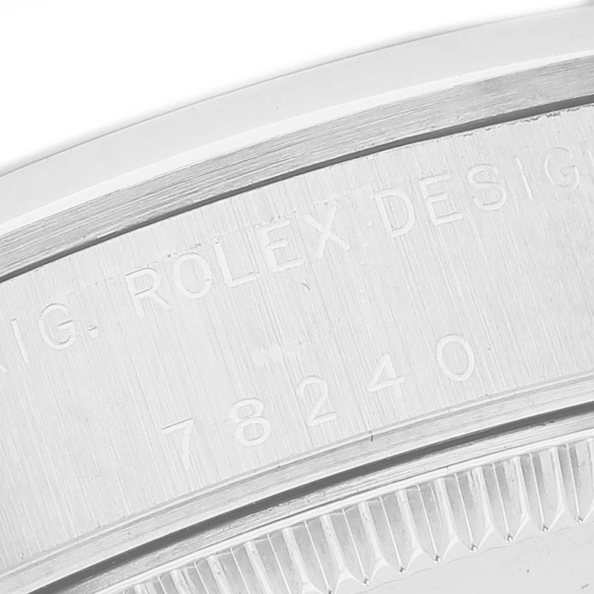 The image shows a close-up of the case engraving on a Rolex Mid-Size 78240 Women's Stainless Steel Silver Dial watch, highlighting the model number and design details.
