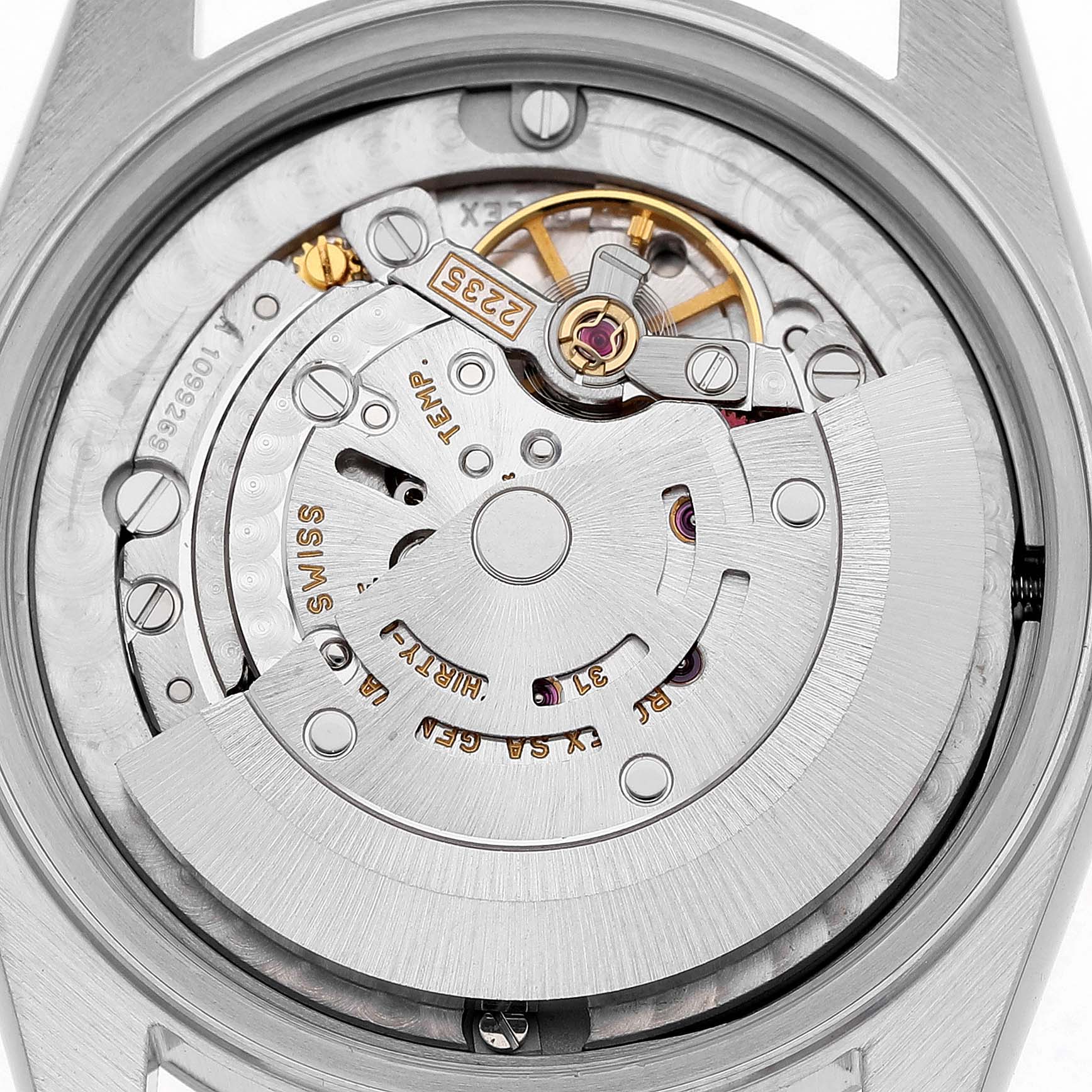 The image shows the inner mechanism of a Rolex Mid-Size 78240 Women's Stainless Steel Silver Dial watch, focusing on the movement parts and rotor.